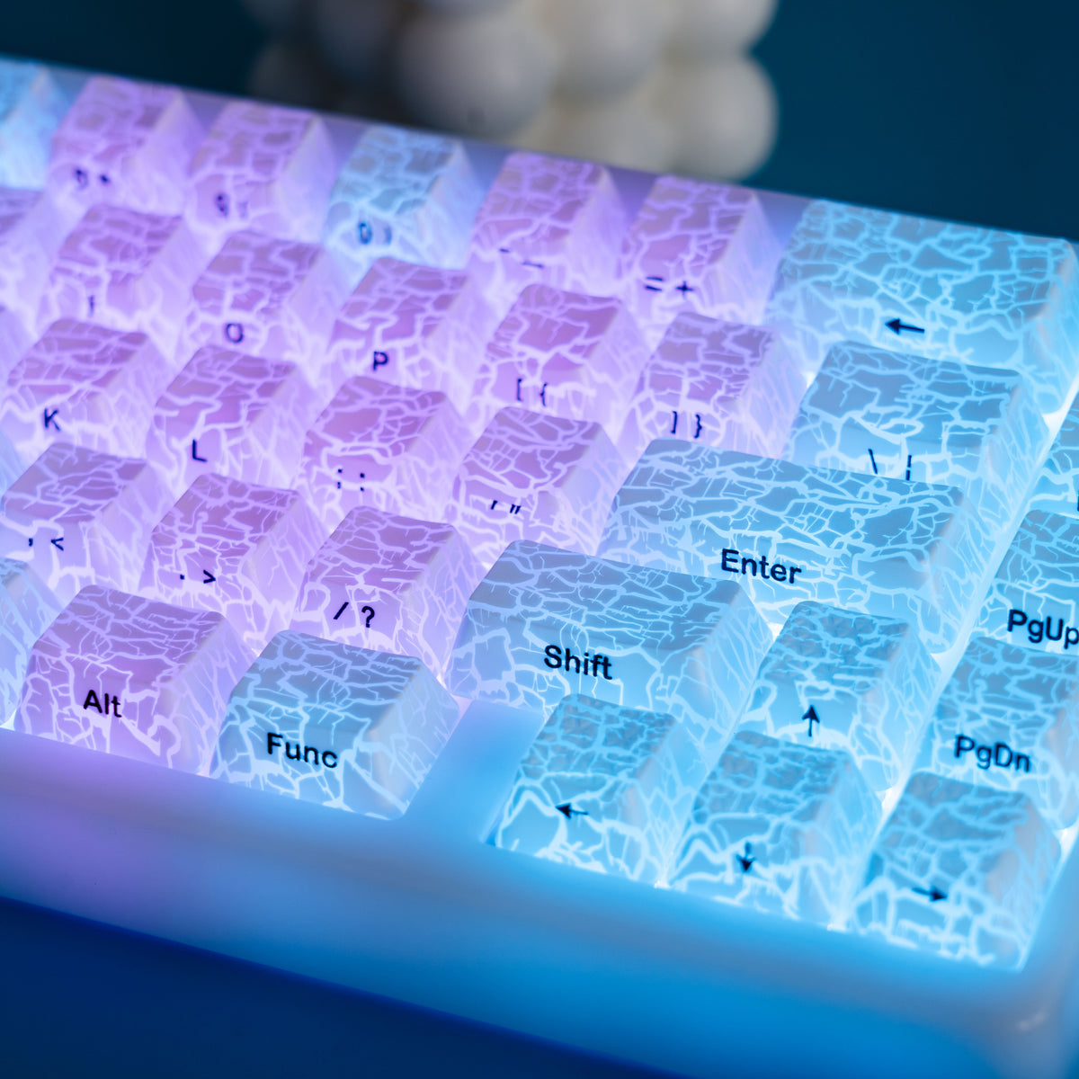Close-up of translucent ice-crack keycaps showing Shift and Enter legends