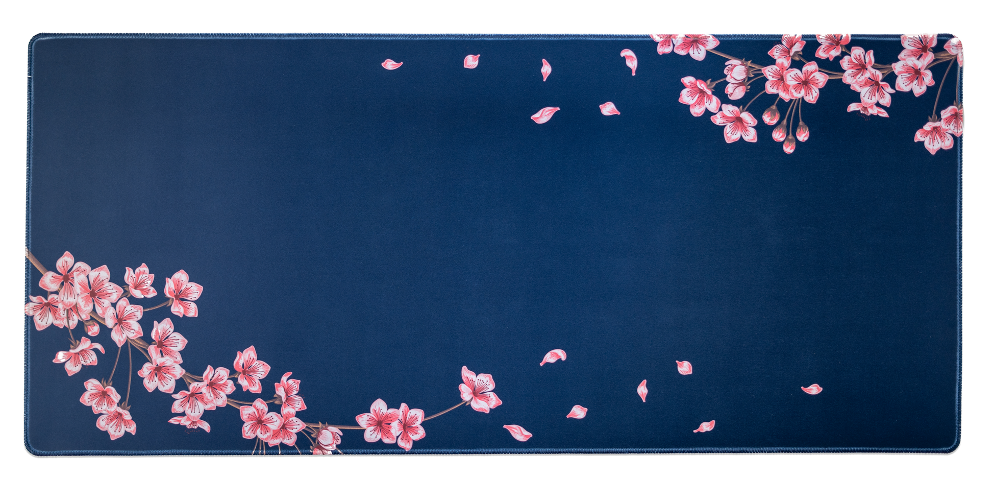 Navy desk mat with pink blossom cluster and small leaf speckles; stitched edge