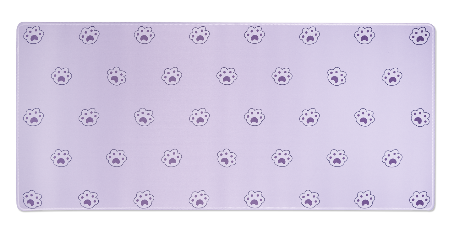 Lavender desk mat with repeating paw-print icons and stitched edges