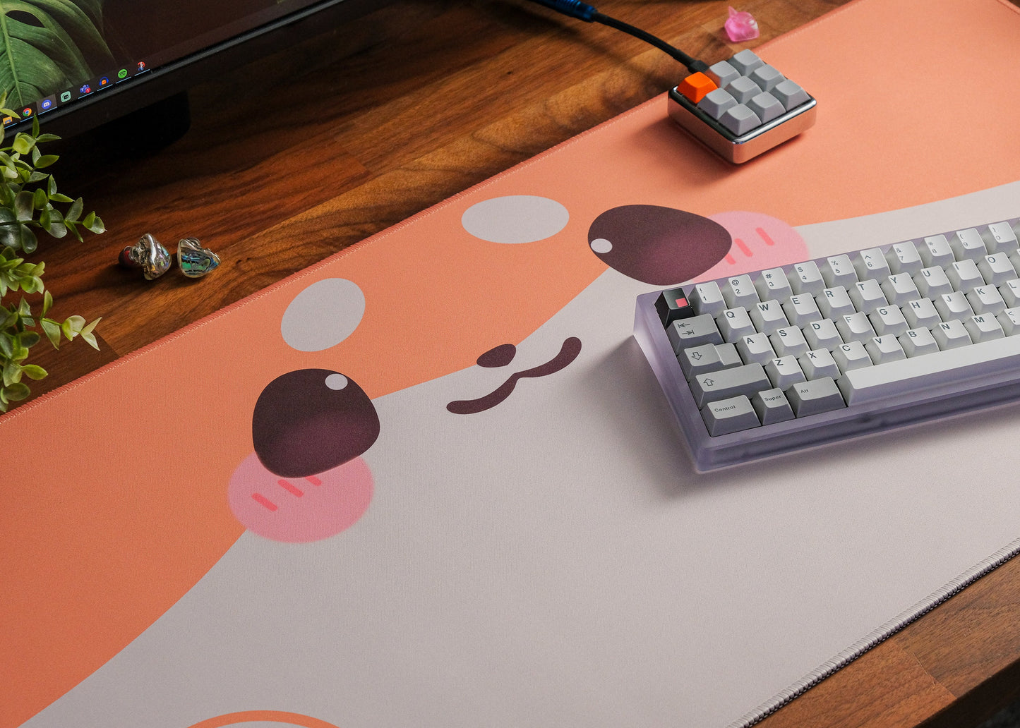 Shiba dog desk mat on wooden desk with dog-face and paw graphics