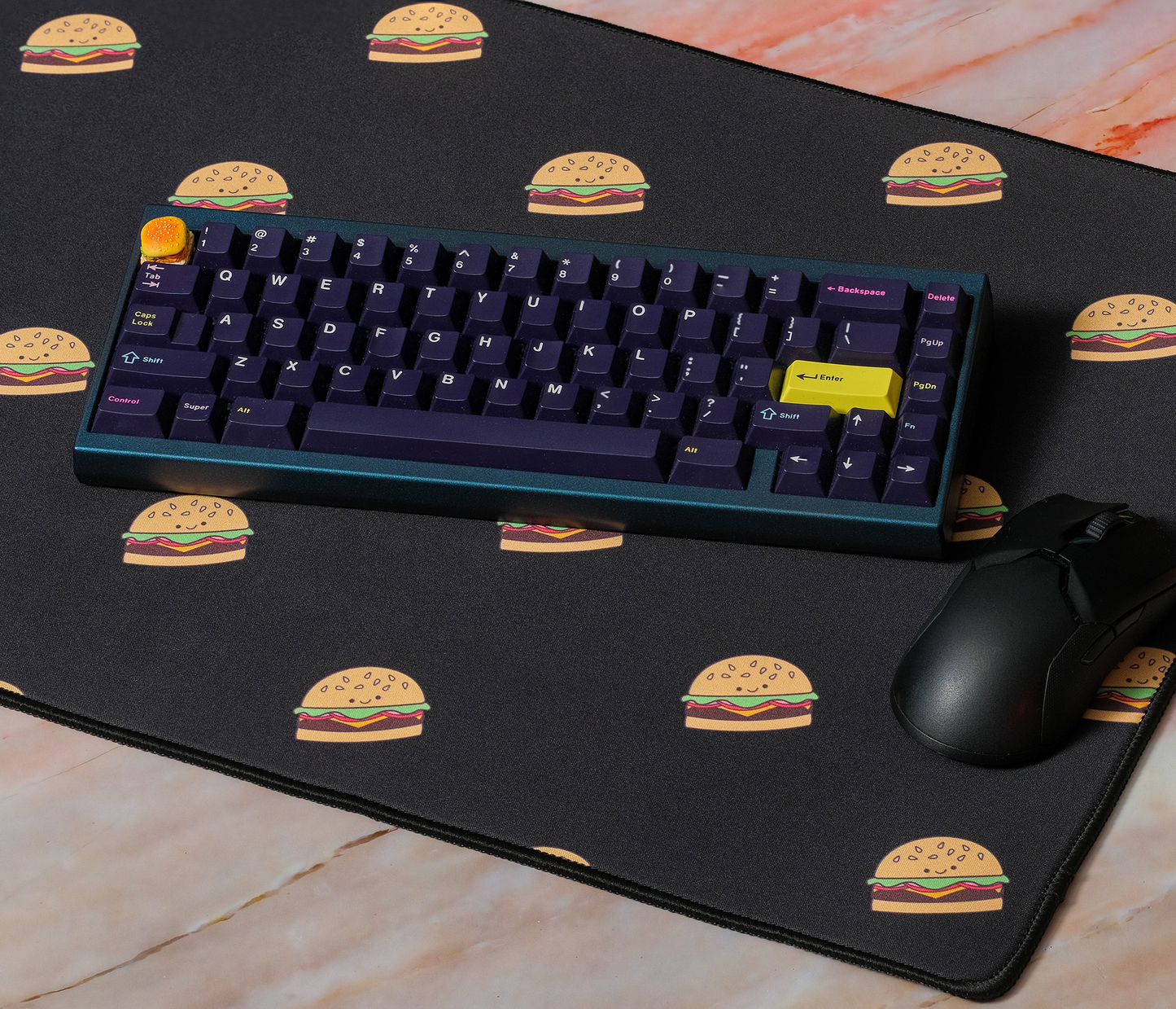 Burger-printed desk mat with blue keyboard and mouse on top