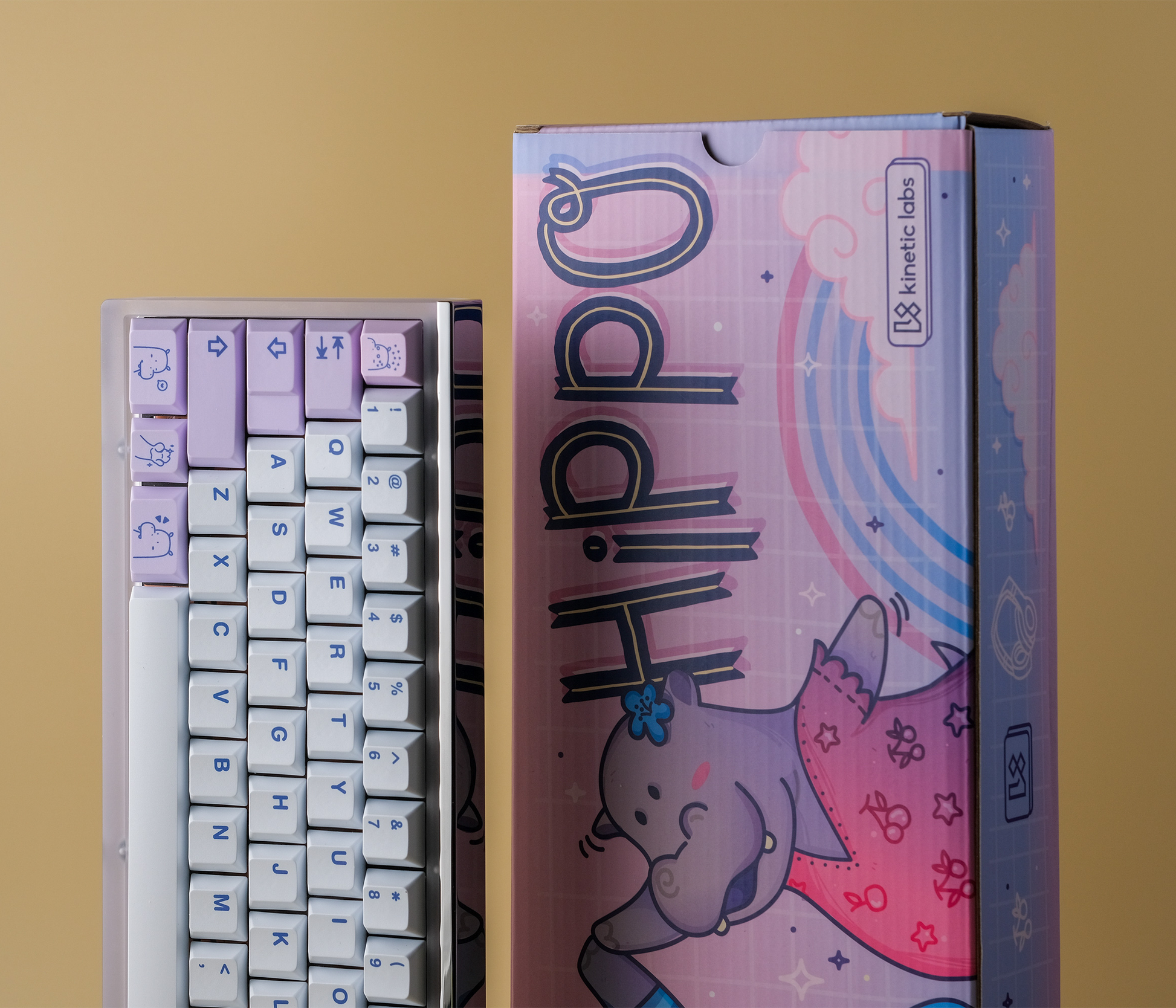 Keycap set box with purple and pink artwork and lilac icon keycaps