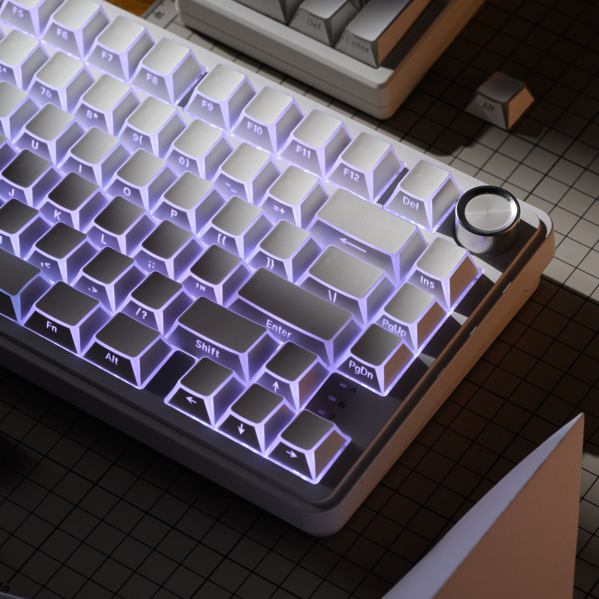 Cherry-profile keycaps with purple-blue glow lighting across the full keyboard layout