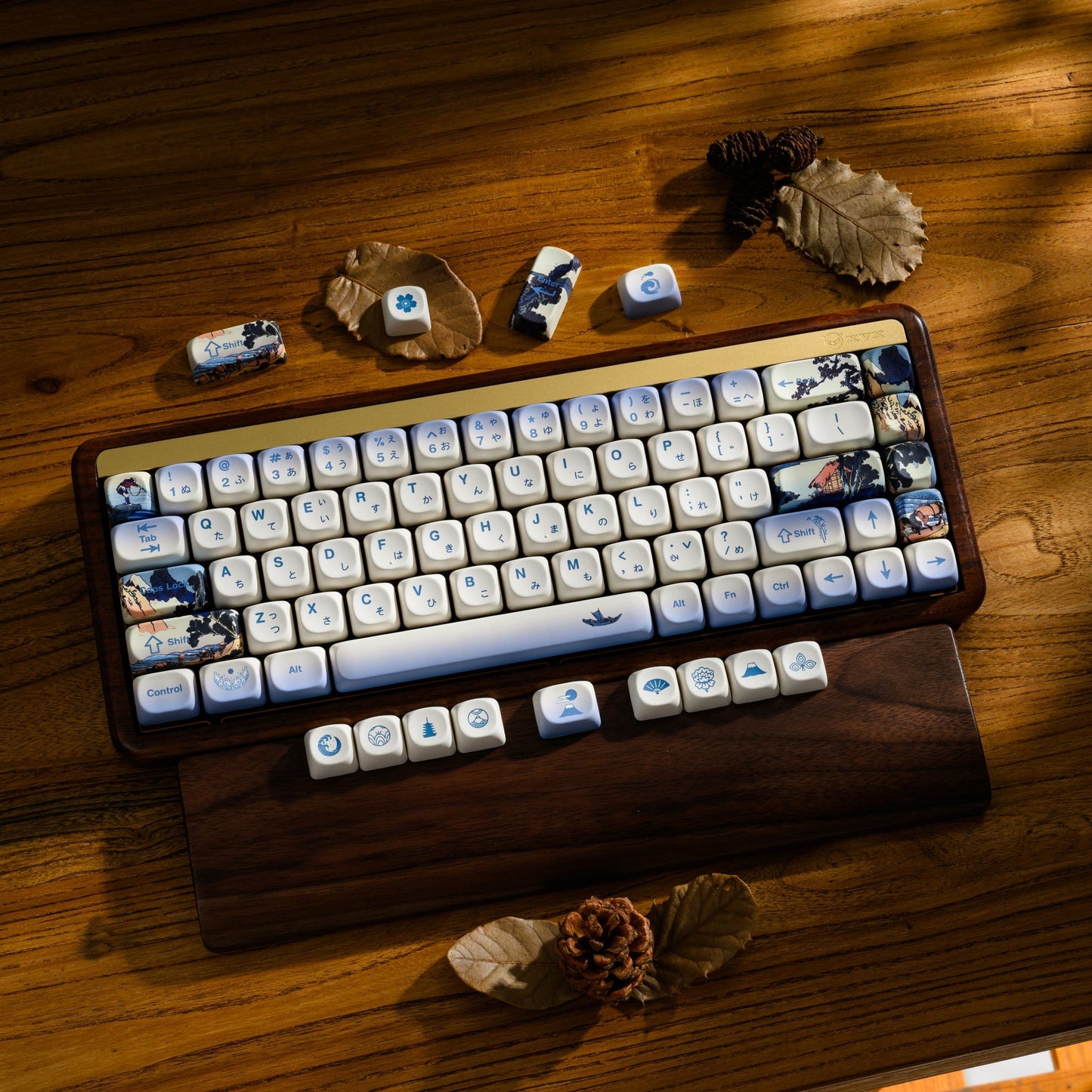 Wood keyboard tray with white and blue MOA-profile keycaps and scenic corner art