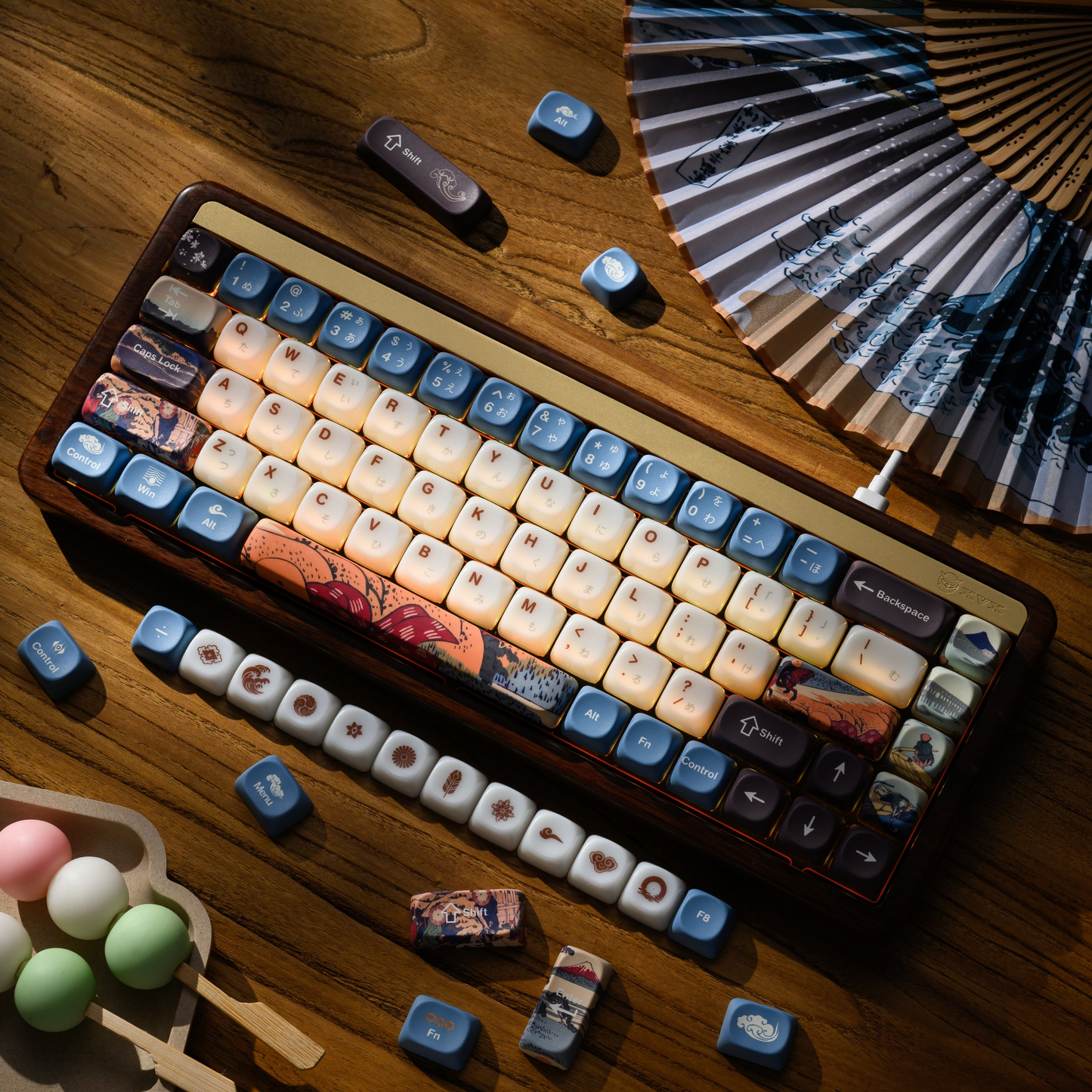 MOA-profile keycap set laid on keyboard, white keys with blue theme graphics