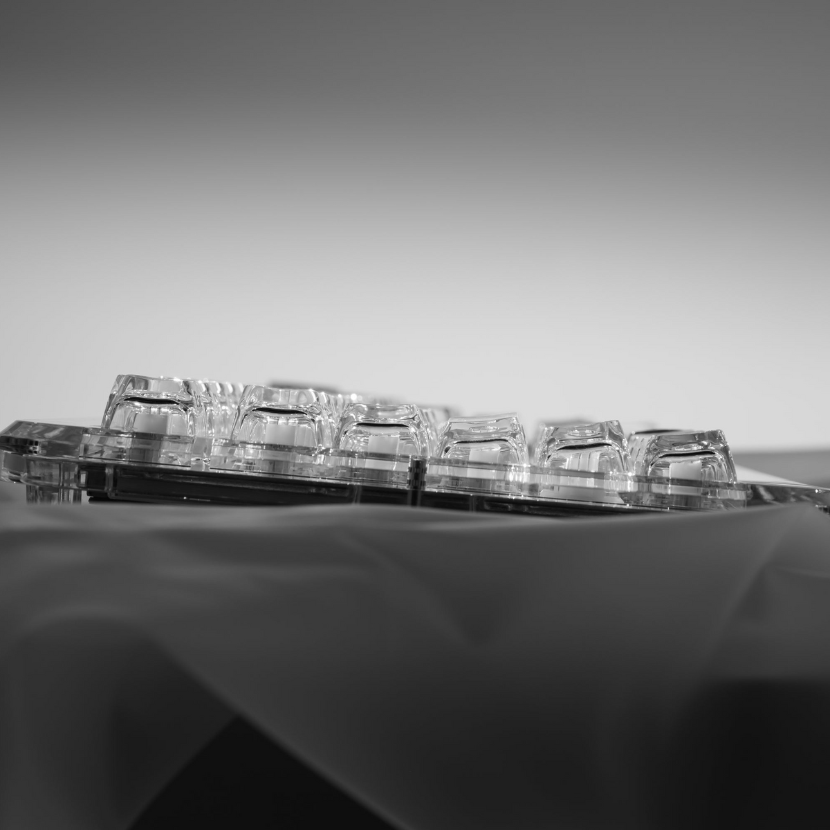 Side view of transparent SA profile keycaps showing key height and clear housing
