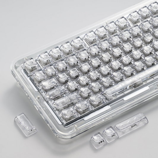 Transparent SA profile keycap set in case with clear legends and a few loose keys