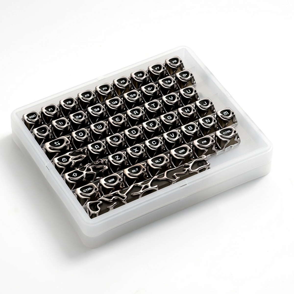 Silver metallic keycaps in a clear plastic tray, top view
