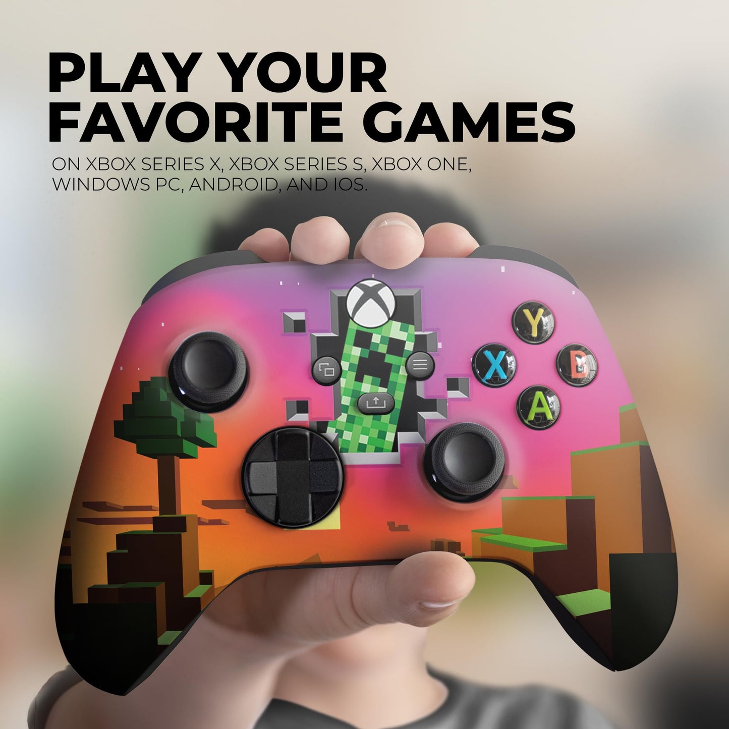 Pink Minecraft-style printed wireless controller held in hand, showing ABXY buttons