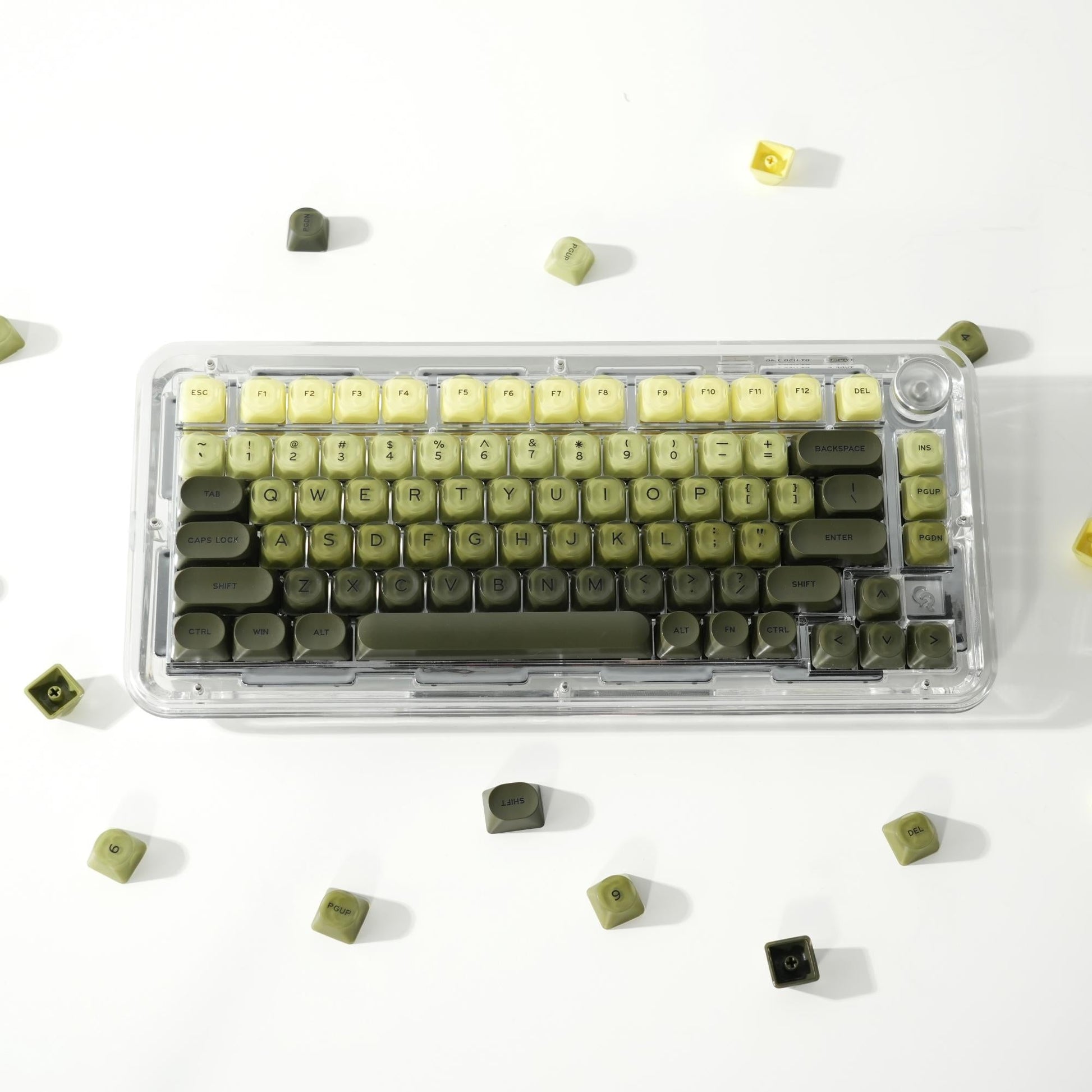 Translucent keycap set, green-yellow tones, 132 keys, in clear storage case