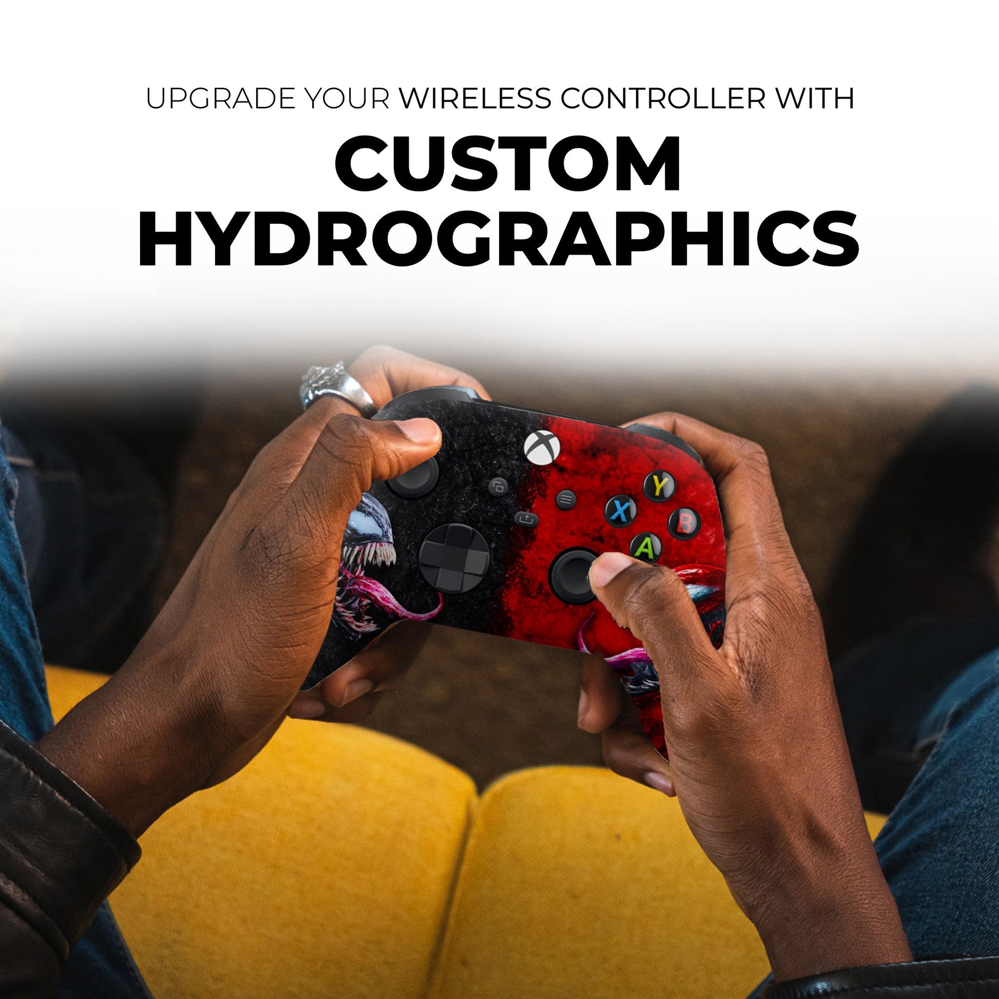 Hands holding Xbox controller with red splatter and monster face design, ABXY buttons