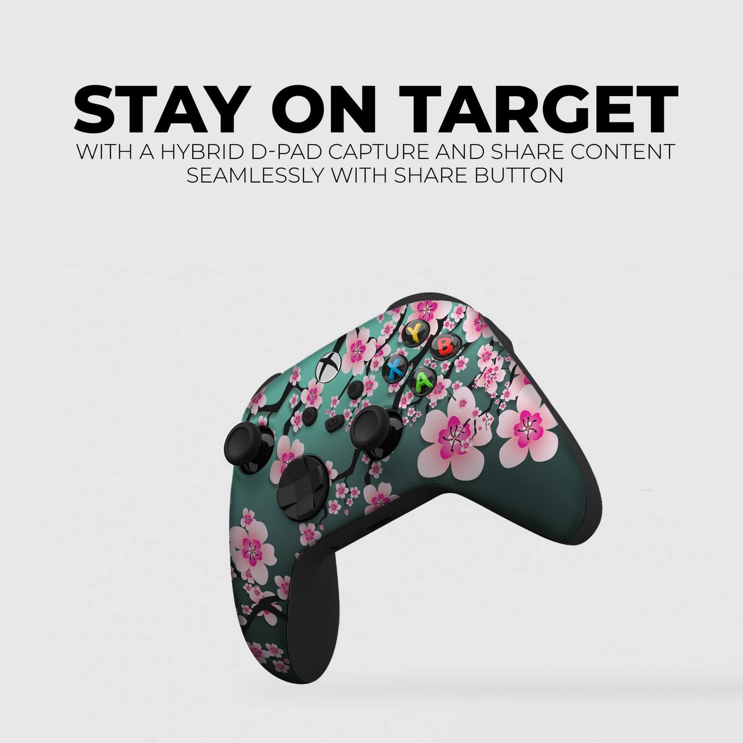 Teal game controller with pink cherry blossom floral print and dark triggers