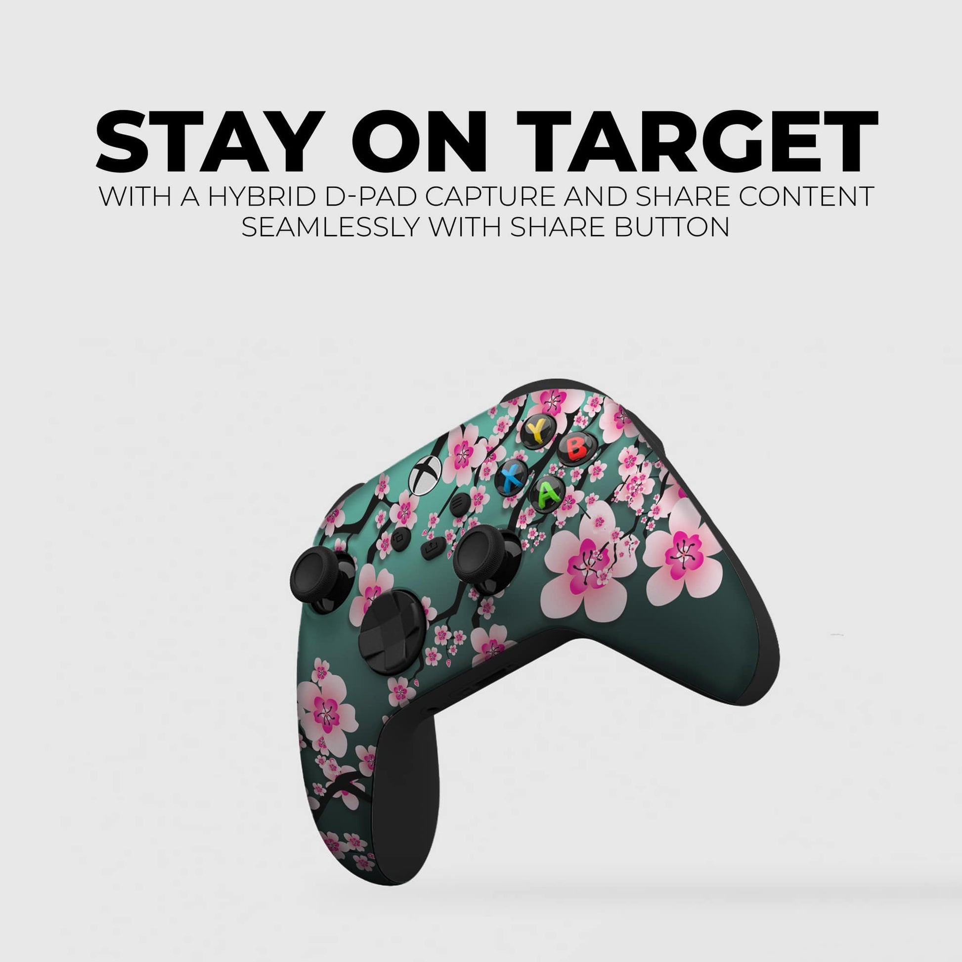 Teal game controller with pink cherry blossom floral print and dark triggers
