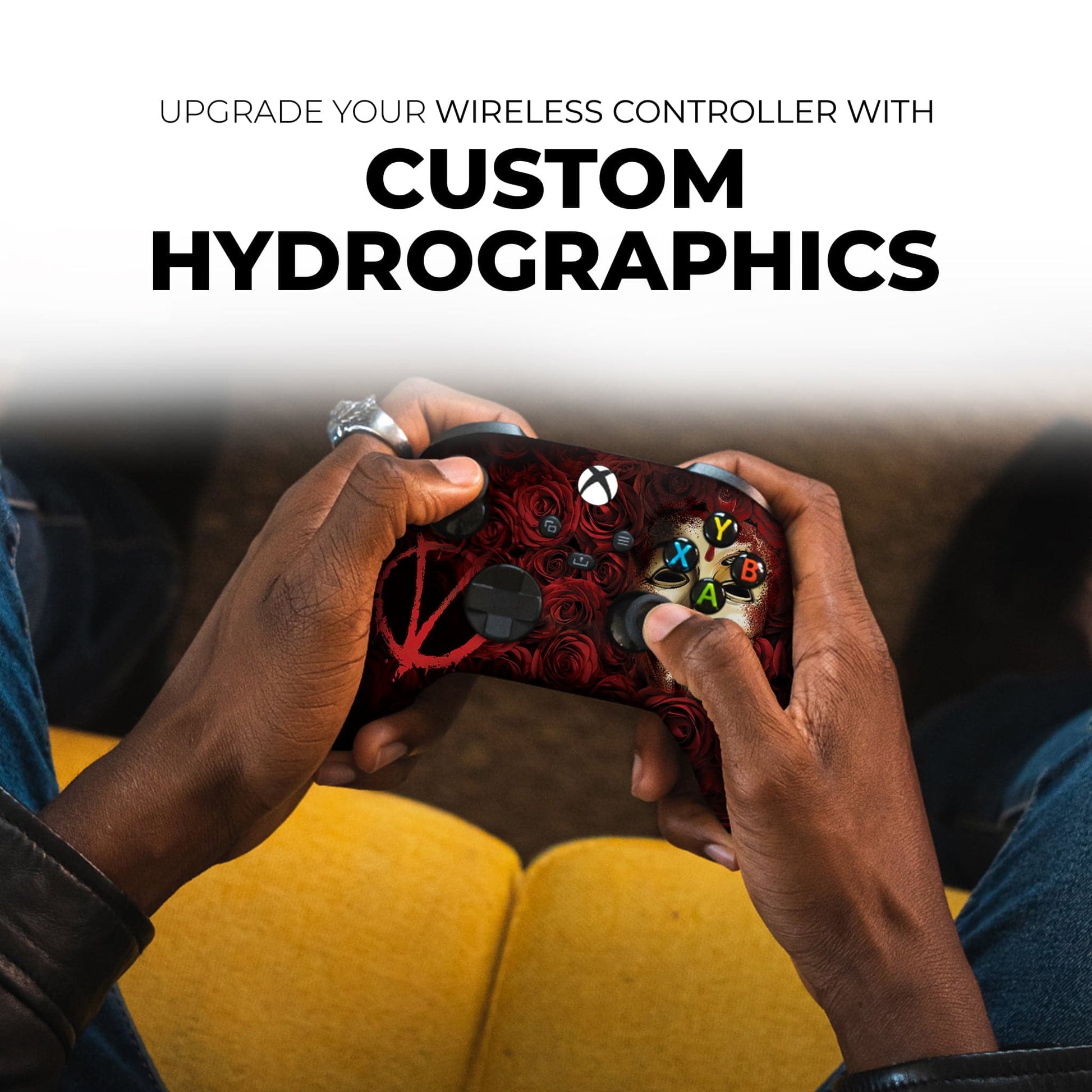 Hands holding a red rose V mask Xbox controller with multicolor A/B/X/Y button icons