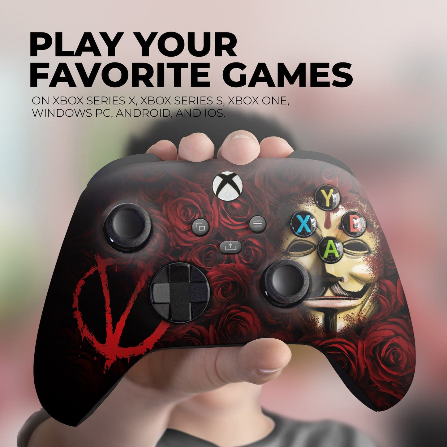 Hand holding Xbox controller featuring red rose V mask artwork and multicolor A/B/X/Y icons