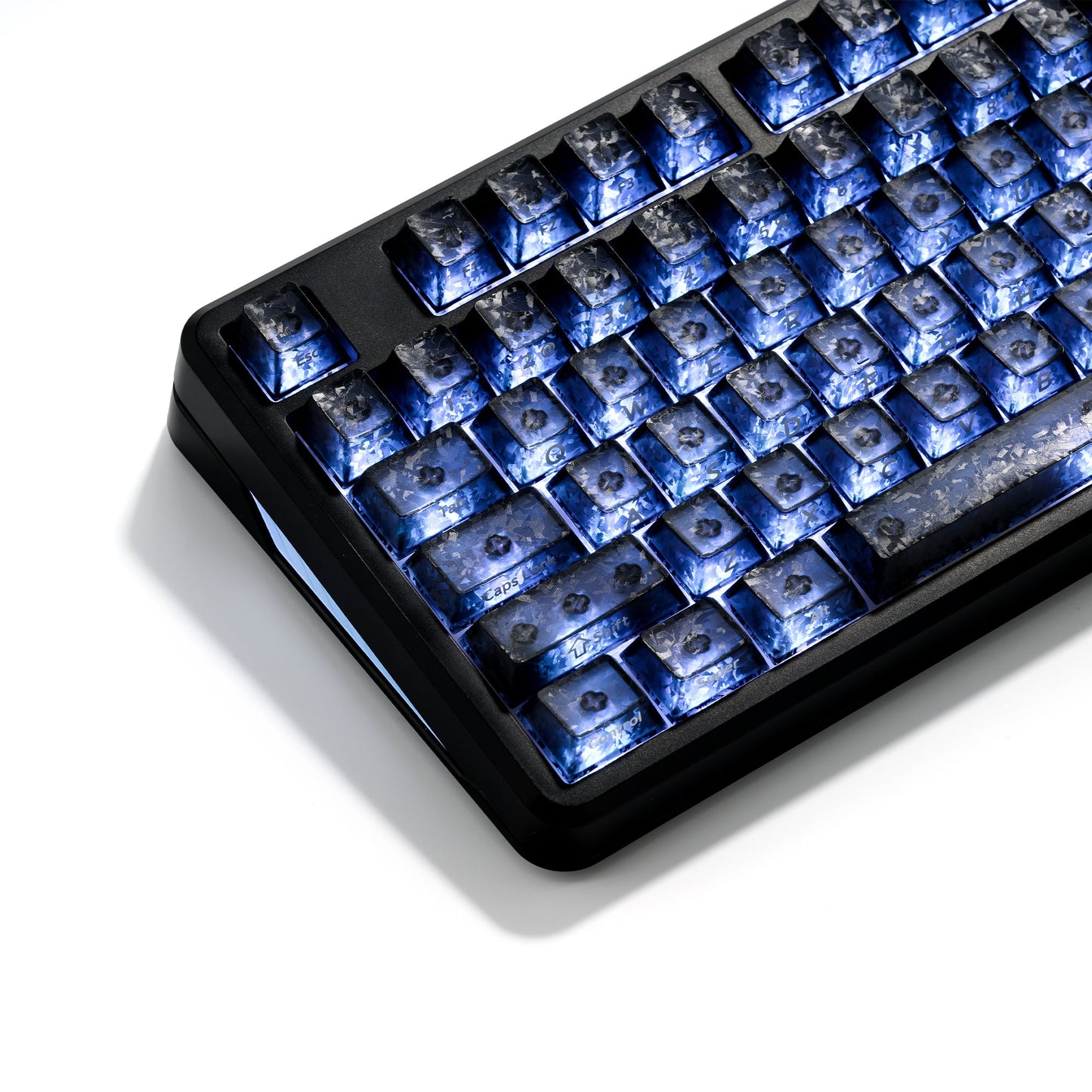 Wireless RGB mechanical keyboard with blue backlit keys and black case, angled close-up