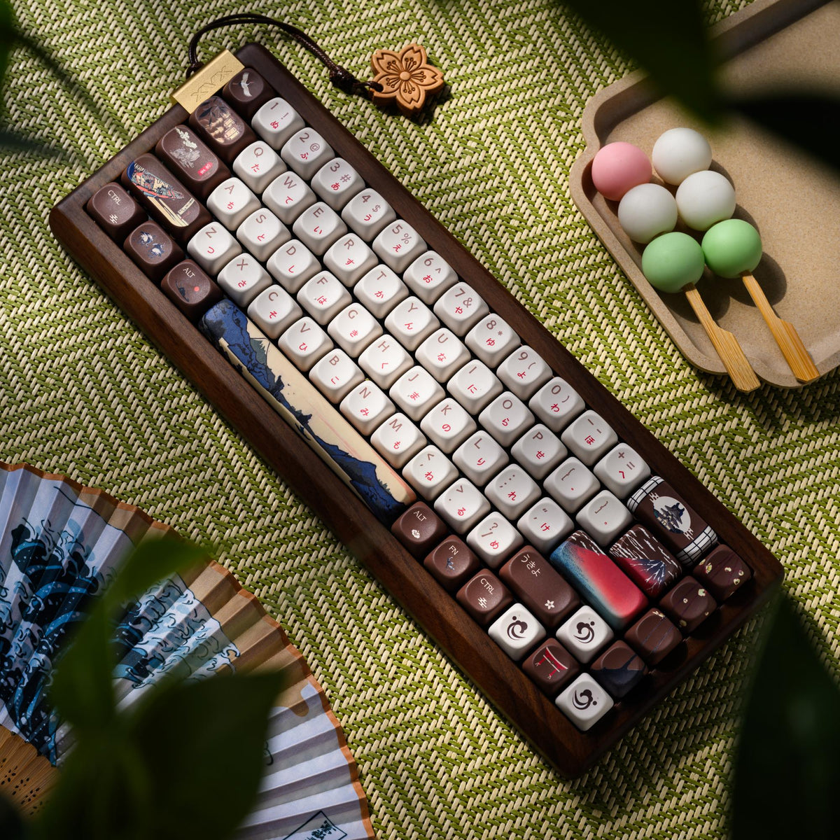 Wireless mechanical keyboard angled view with mixed keycaps and landscape accents on keys