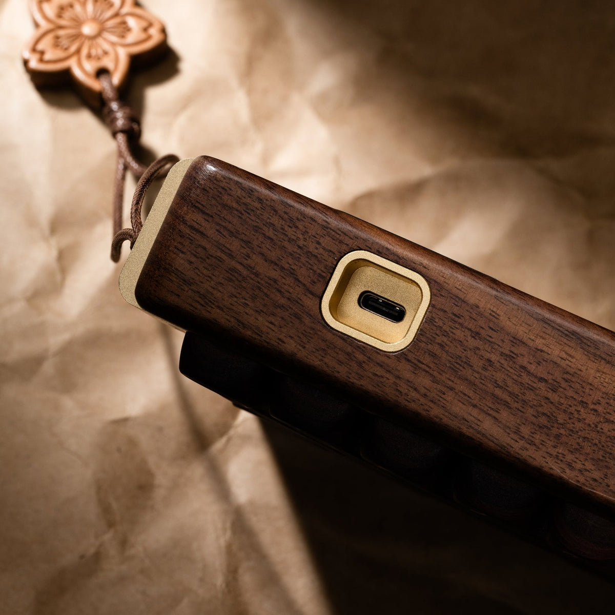 Wireless mechanical keyboard side panel with wooden body, USB charging port, and lanyard