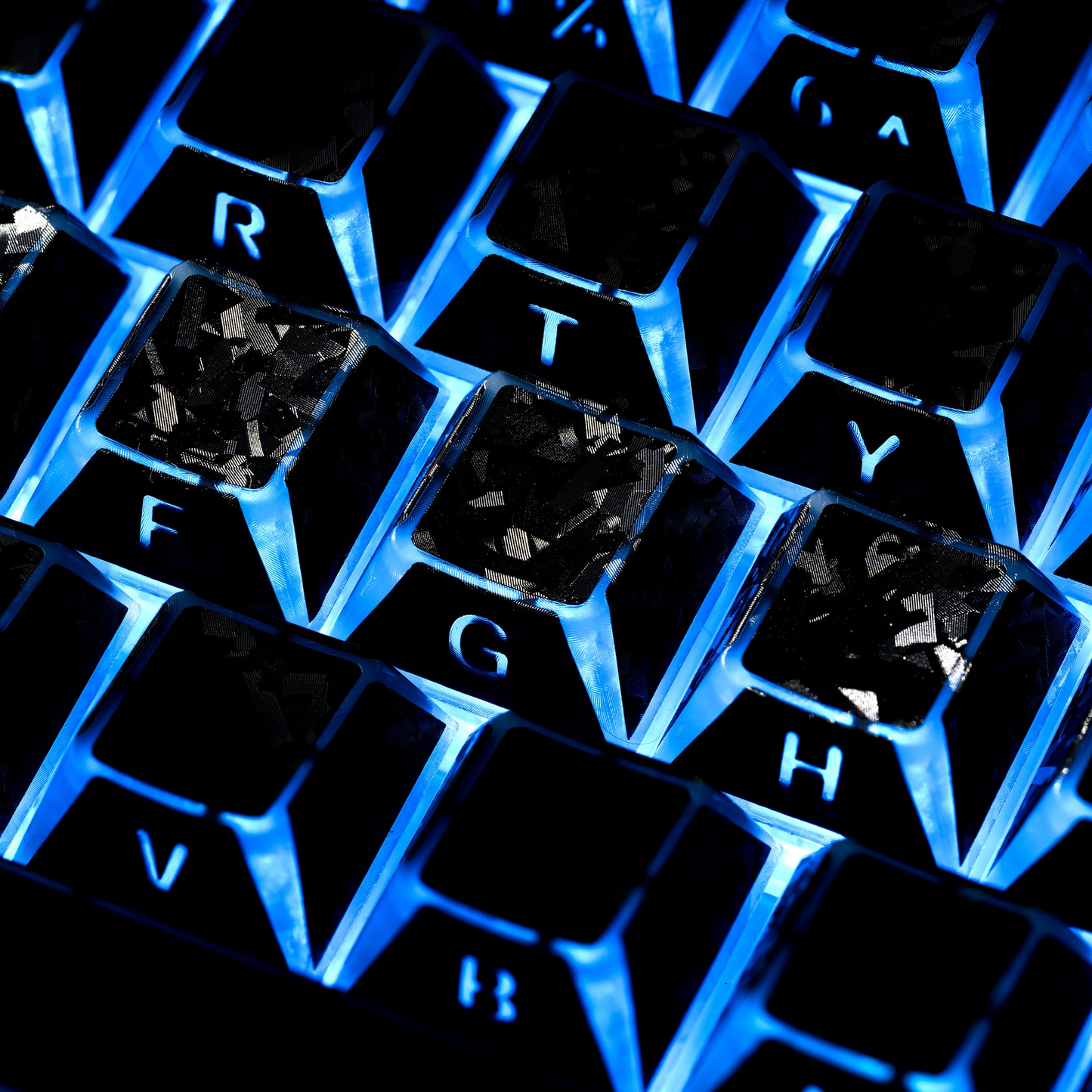 Blue-lit shine-through keycaps with visible letters and frosted textured keytops