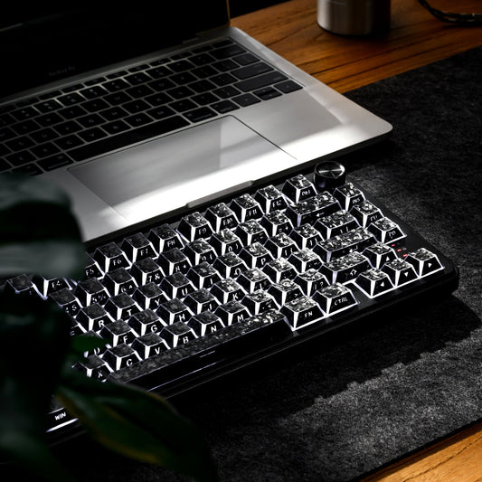 Black shine-through cherry-profile keycaps with frosted tops and visible legends