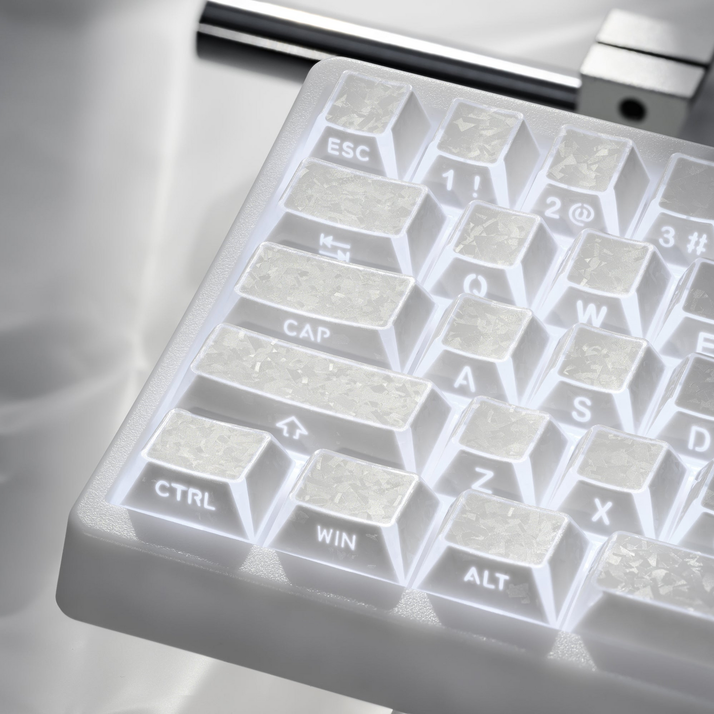 Close-up of translucent white keycaps showing ESC, CTRL, WIN and ALT legends