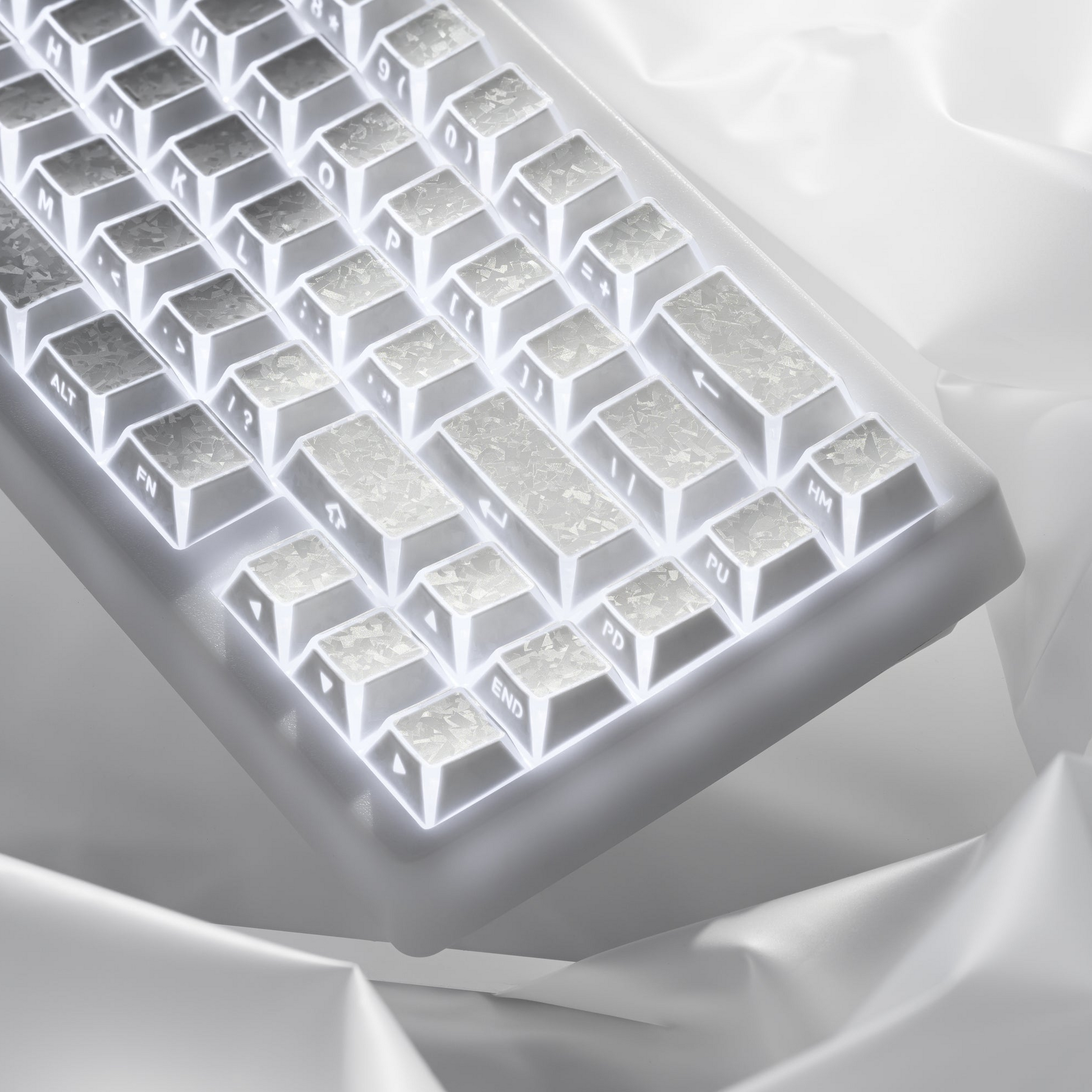 White shine-through cherry-profile keycaps with sculpted legends, backlit in a grid