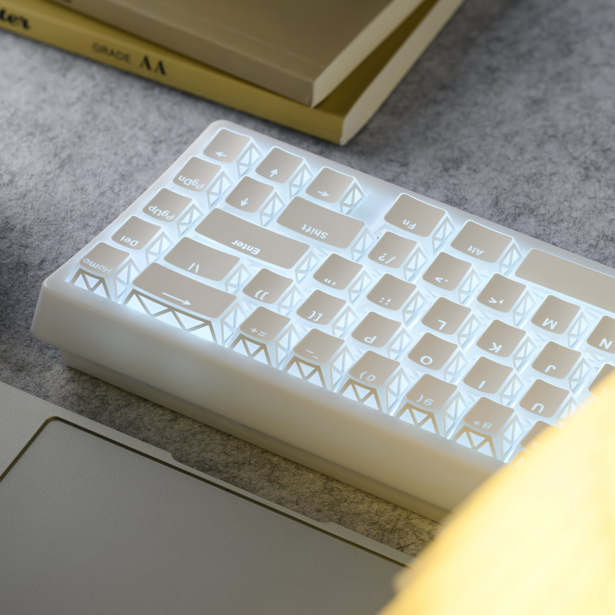 White PBT keycaps glowing pale blue with prism-style legend icons