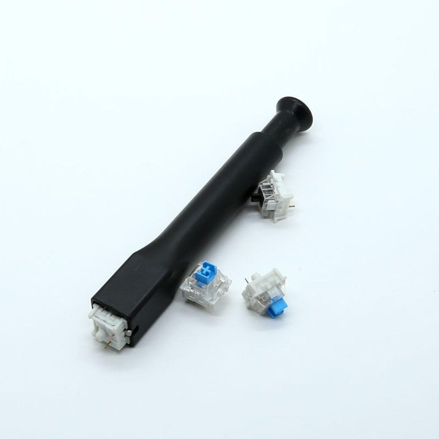 Black keyboard switch remover tool with several small mechanical switches