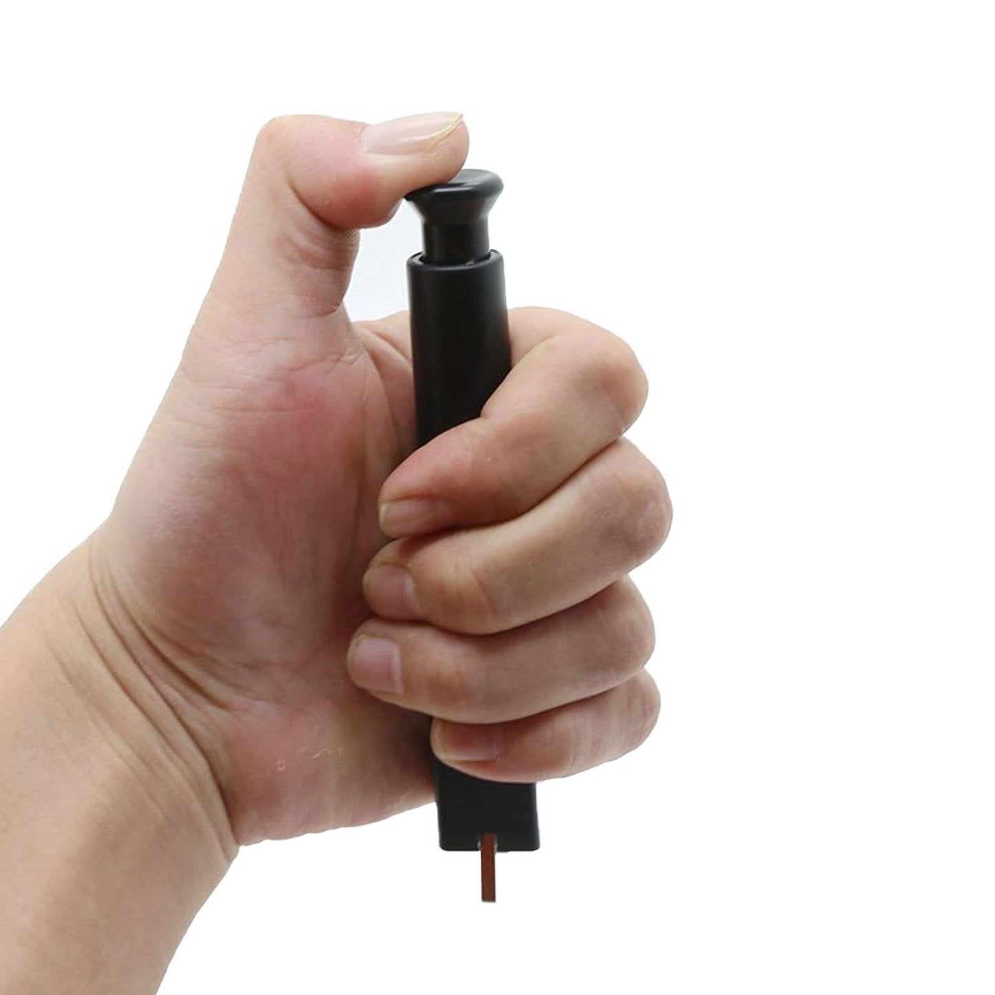 Hand holding black keyboard switch remover tool with exposed pin