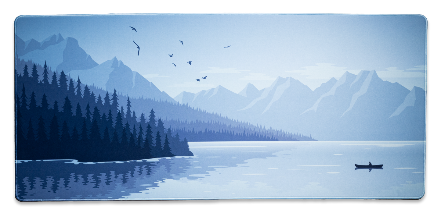 Alberta V2 desk mat with light blue mountain and forest landscape, plane over lake