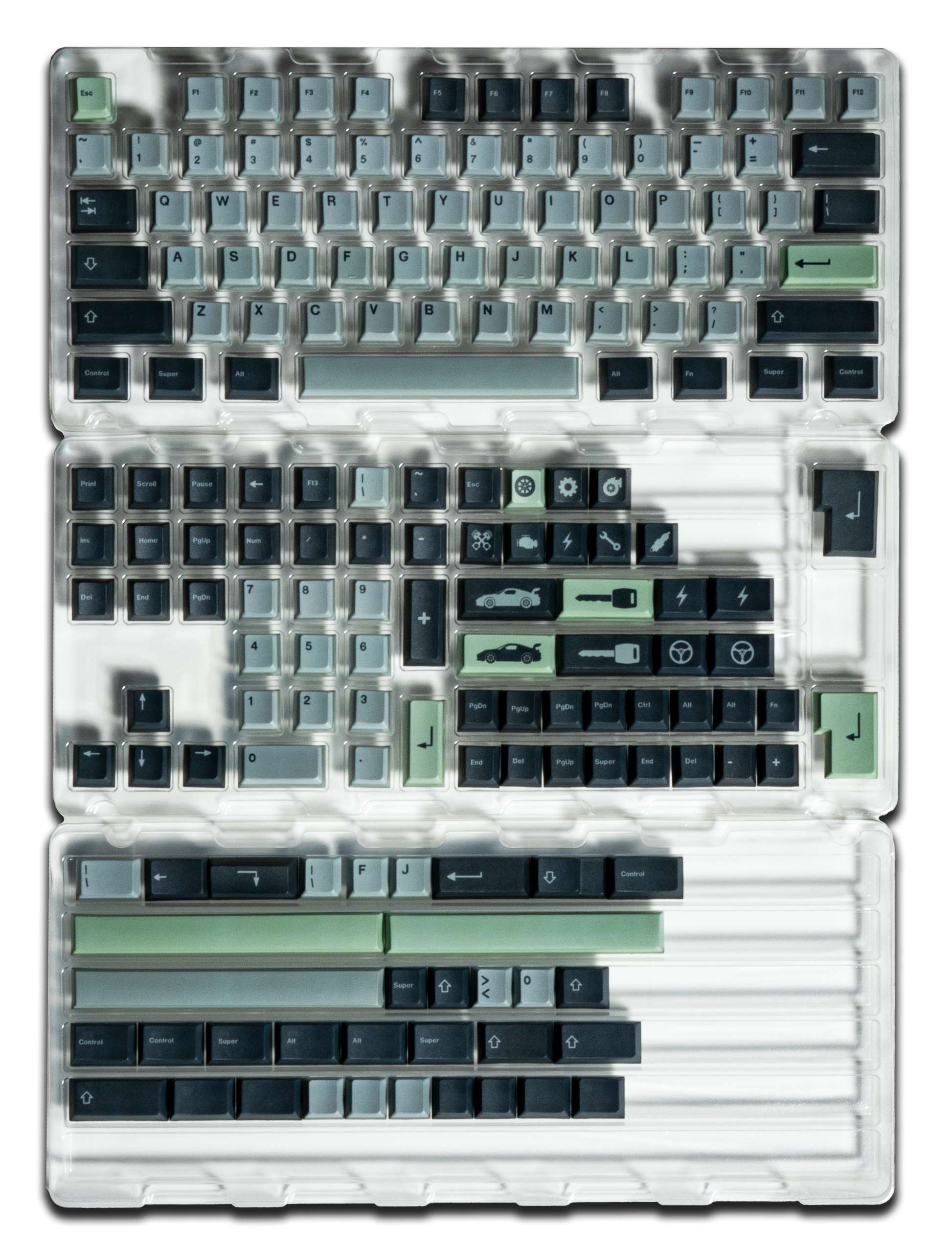 Keycaps set in clear tray: light gray, dark navy, and pale green accent caps