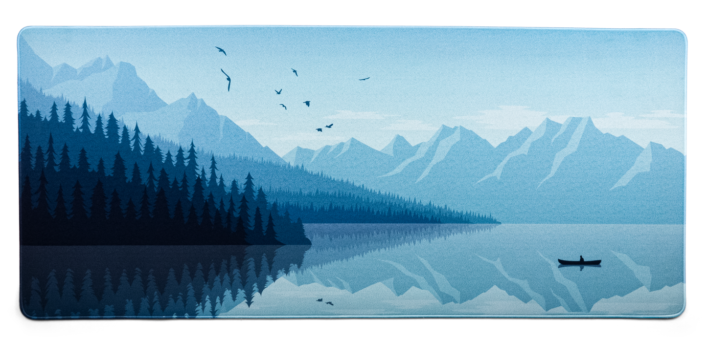 Alberta V2 desk mat with pale blue mountain lake landscape, birds and plane