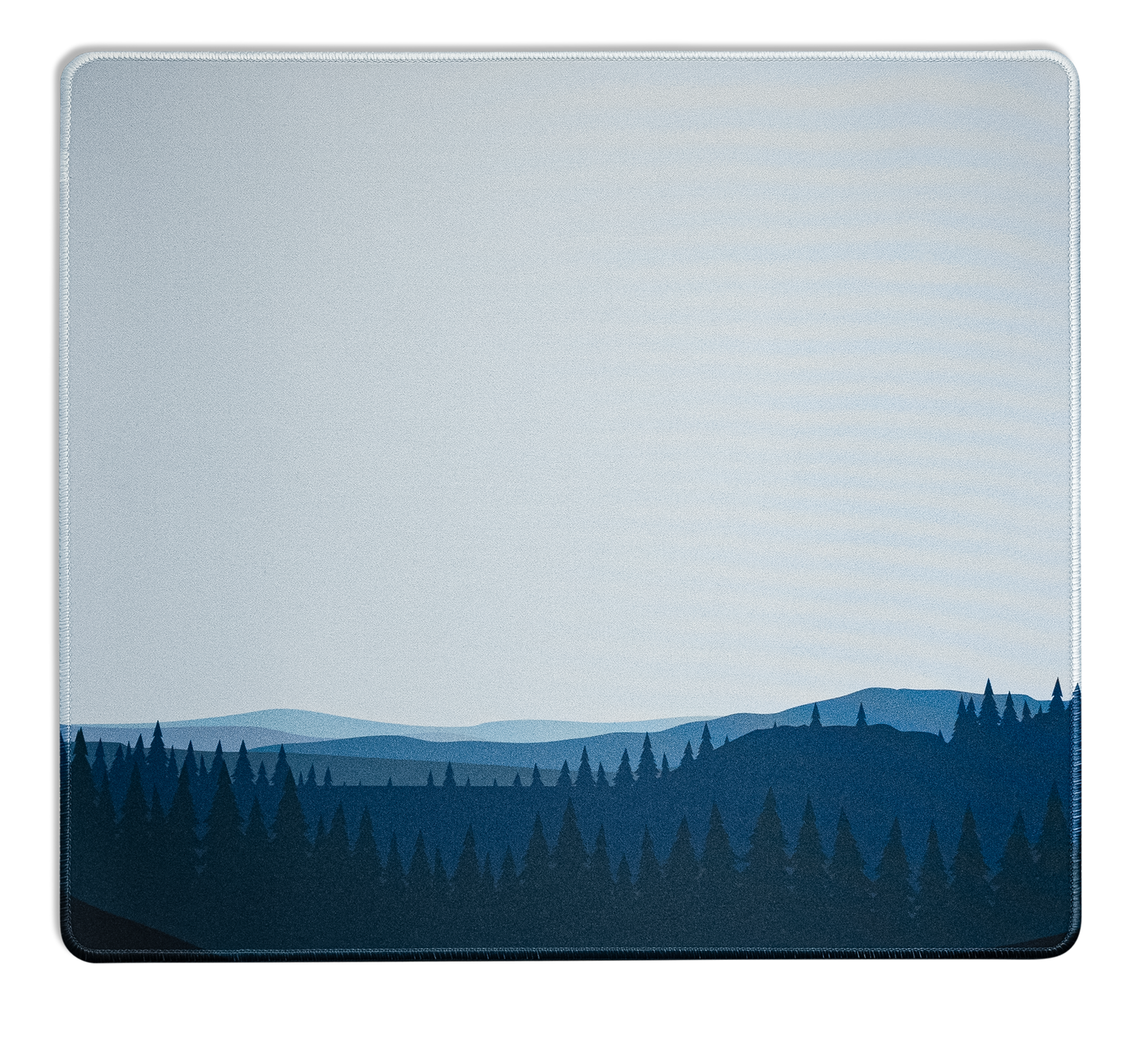 Desk mat with blue forest and hills graphic, light top panel and stitched edges