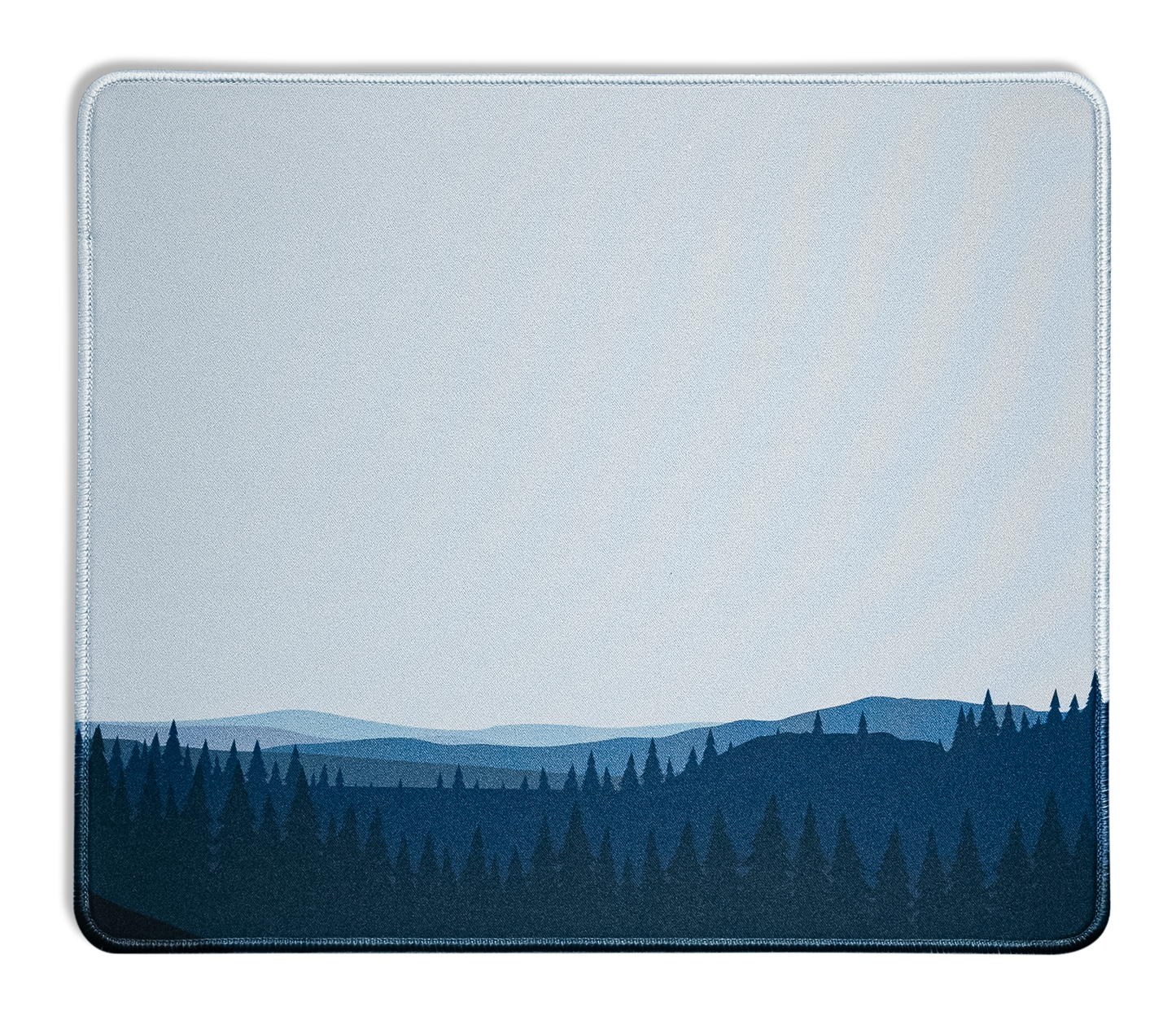 Rectangular desk mat with blue forest horizon print and light stitched border