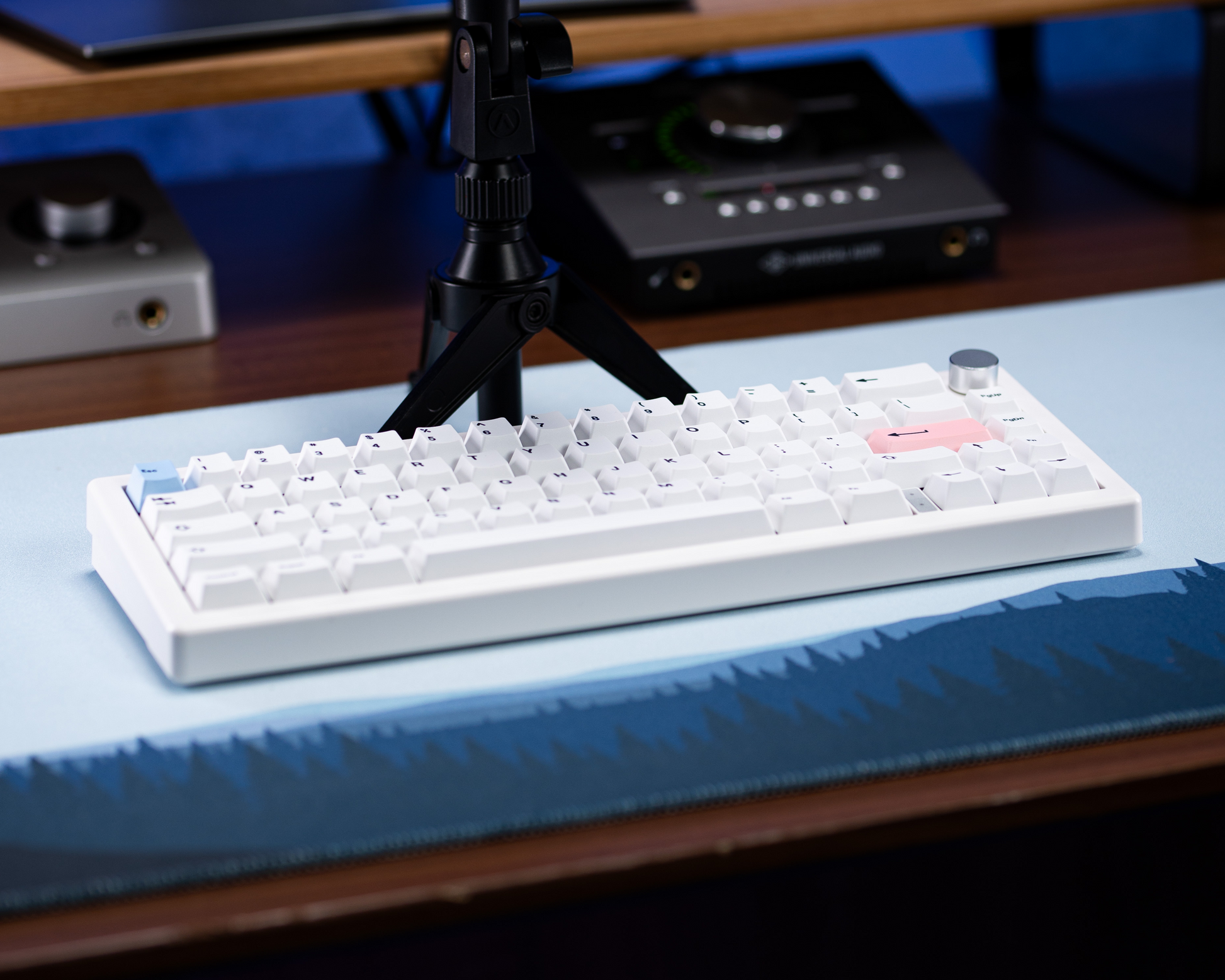 PBT keycaps set: white keys with a small pink accent keycap in view.