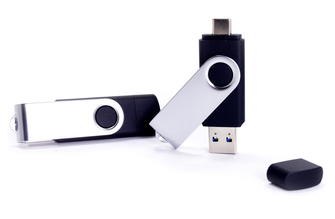 Dual USB flash drive with silver rotating cap and black connector housing