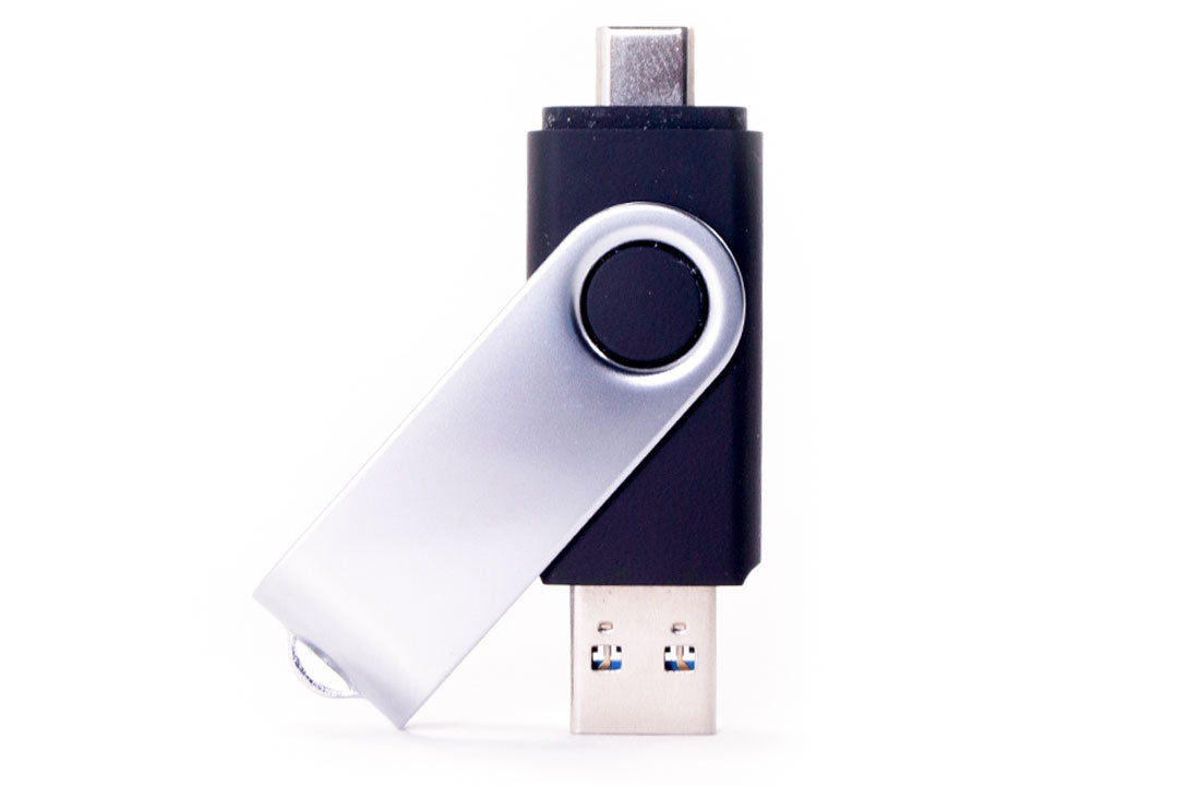 Dual USB flash drive with black and silver metal body and circular keyring loop