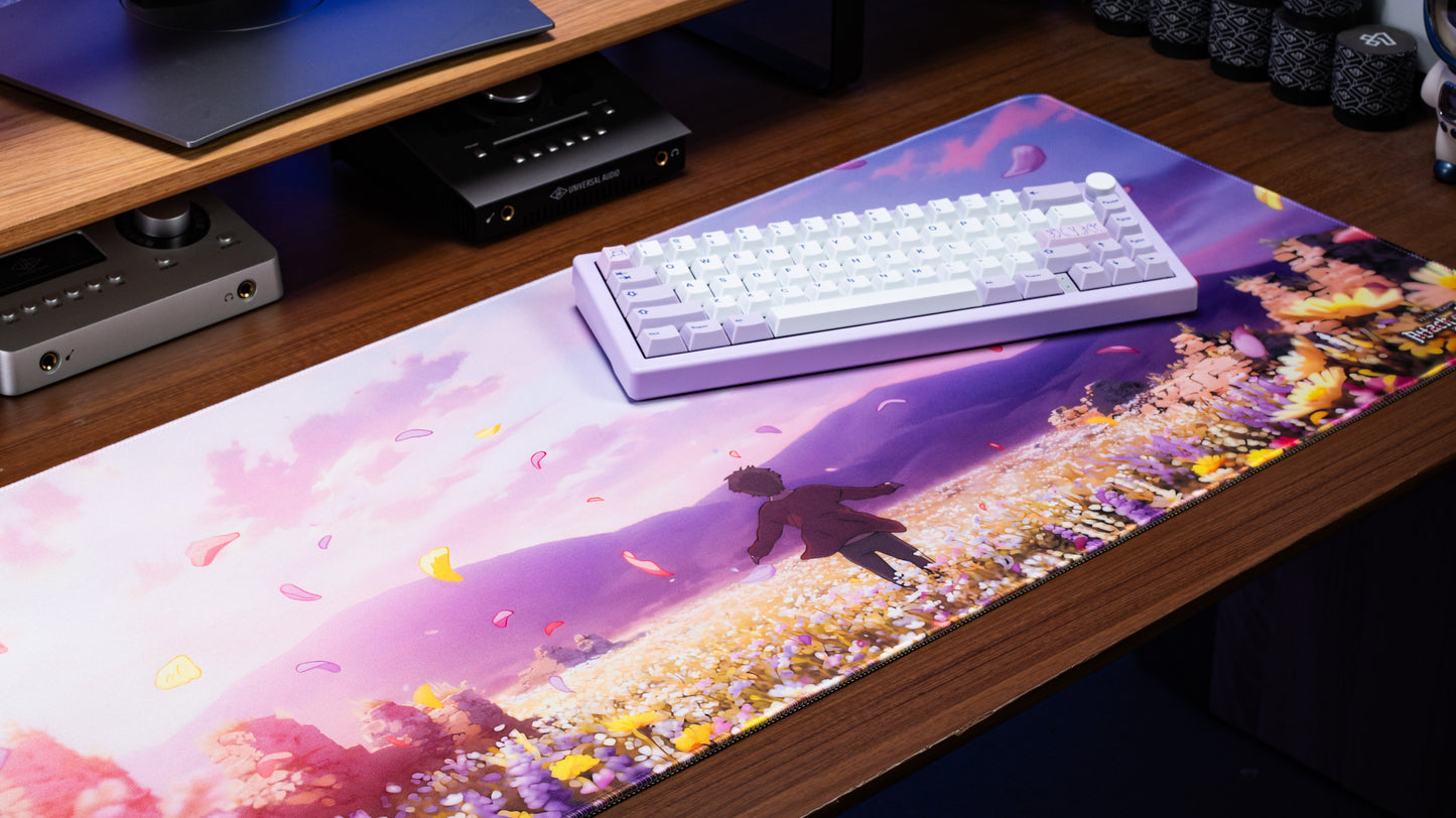 Anime desk mat with scenic landscape, falling flowers, and silhouetted figure