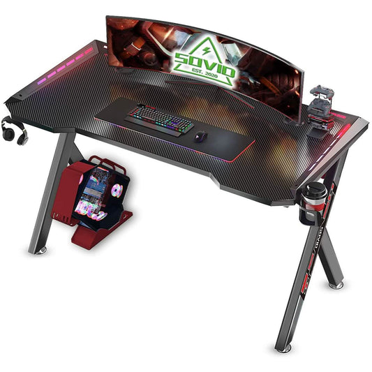 Gaming desk with black textured top, RGB LED lighting, keyboard tray and mouse pad