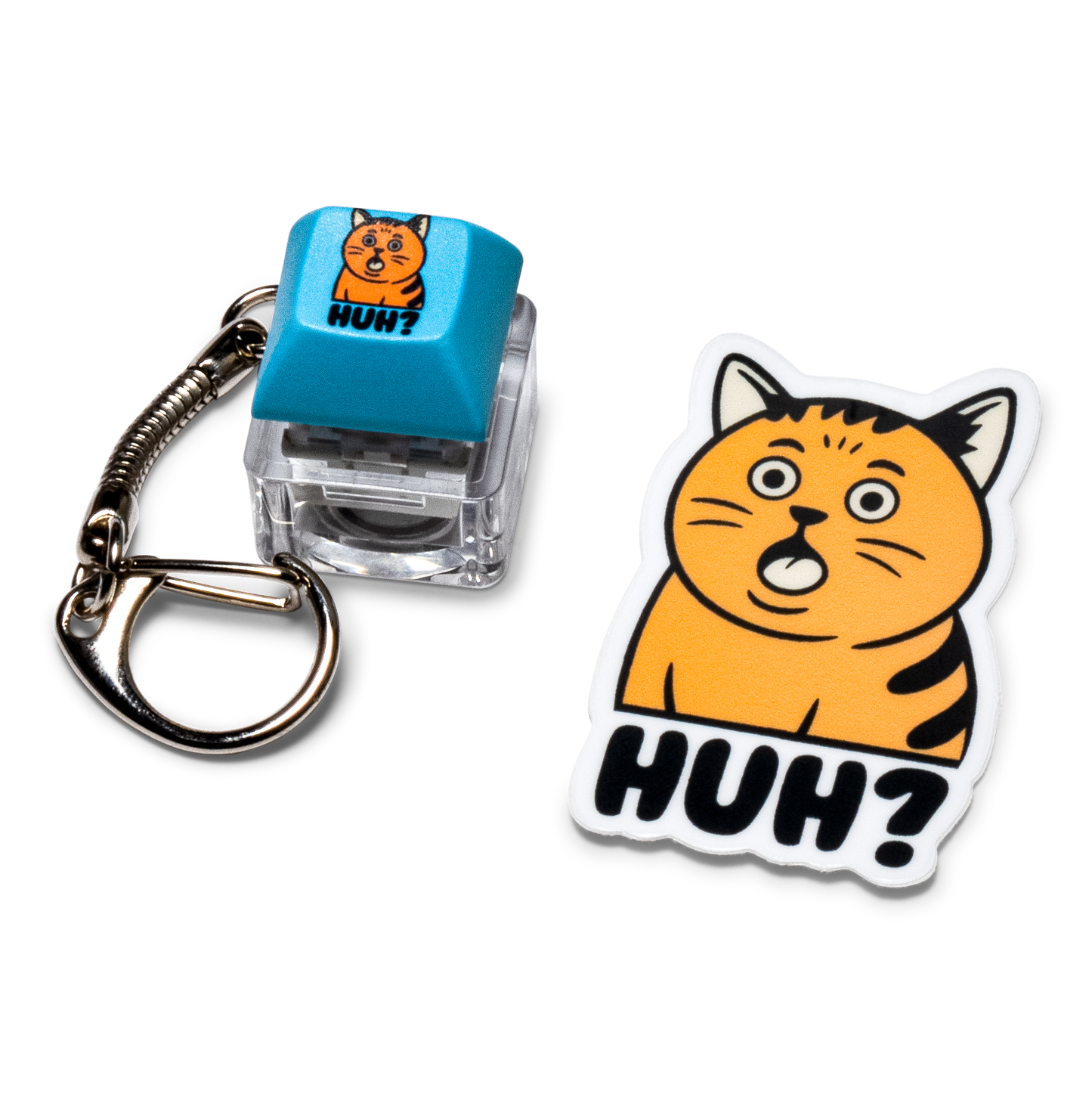 Blue keycap fidget keychain with "HUH?!" and white orange cat "HUH?!" sticker.