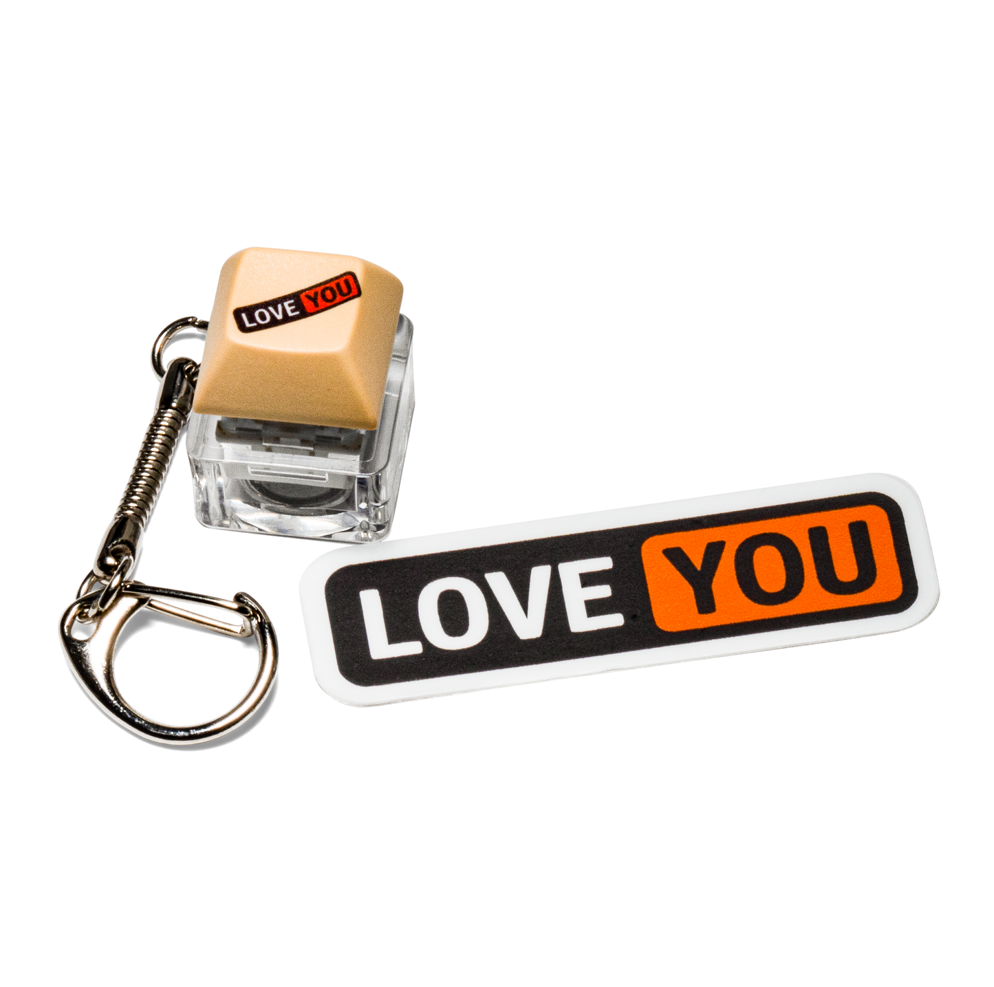 Tan keycap fidget keychain with "LOVE YOU" graphic and white "LOVE YOU" sticker.