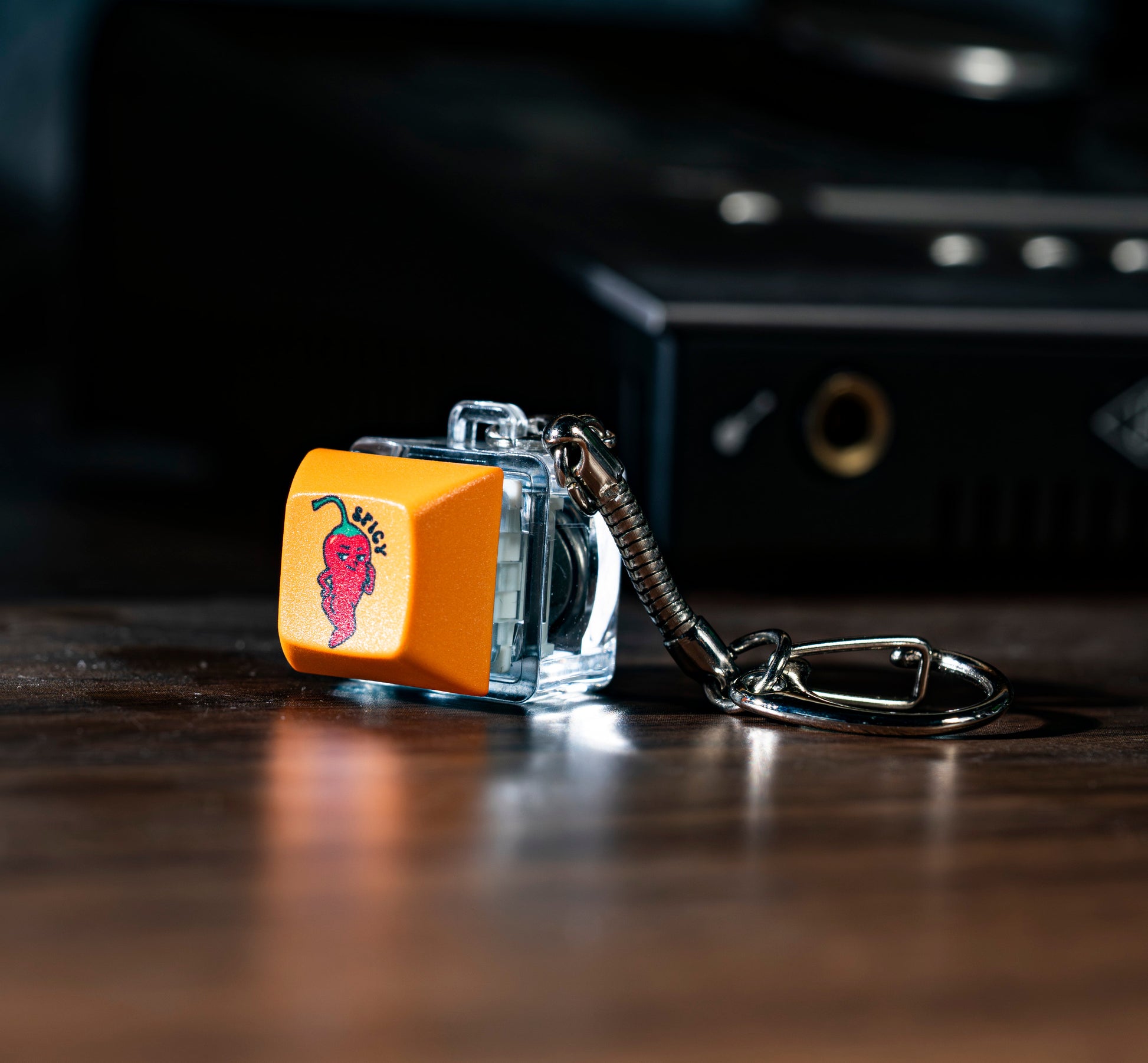 Funny keycap fidget keychain with orange cat keycap on clear base and metal keyring
