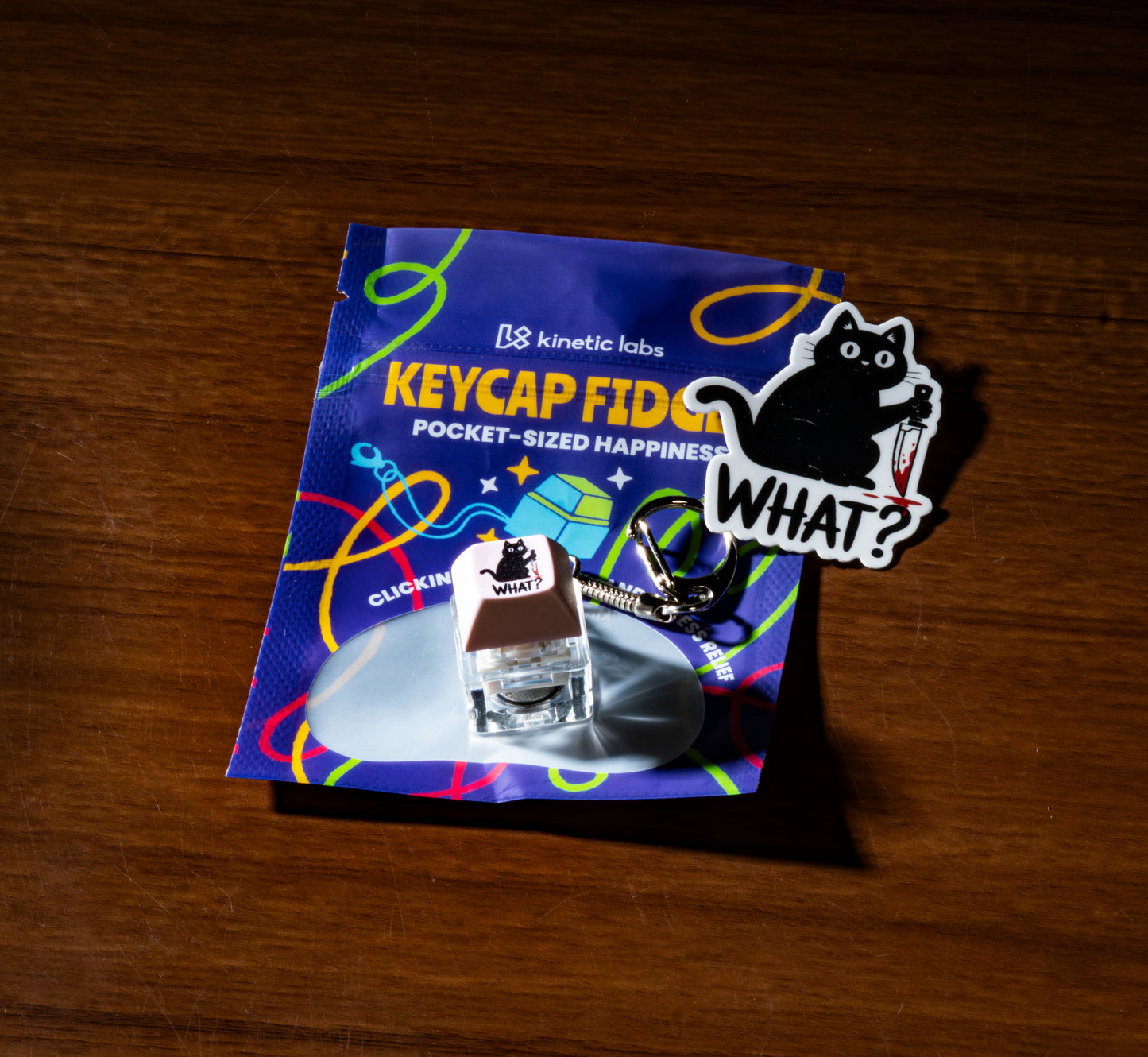 Funny keycap fidget keychain with blue “KEYCAP FID…” themed packaging and keycap