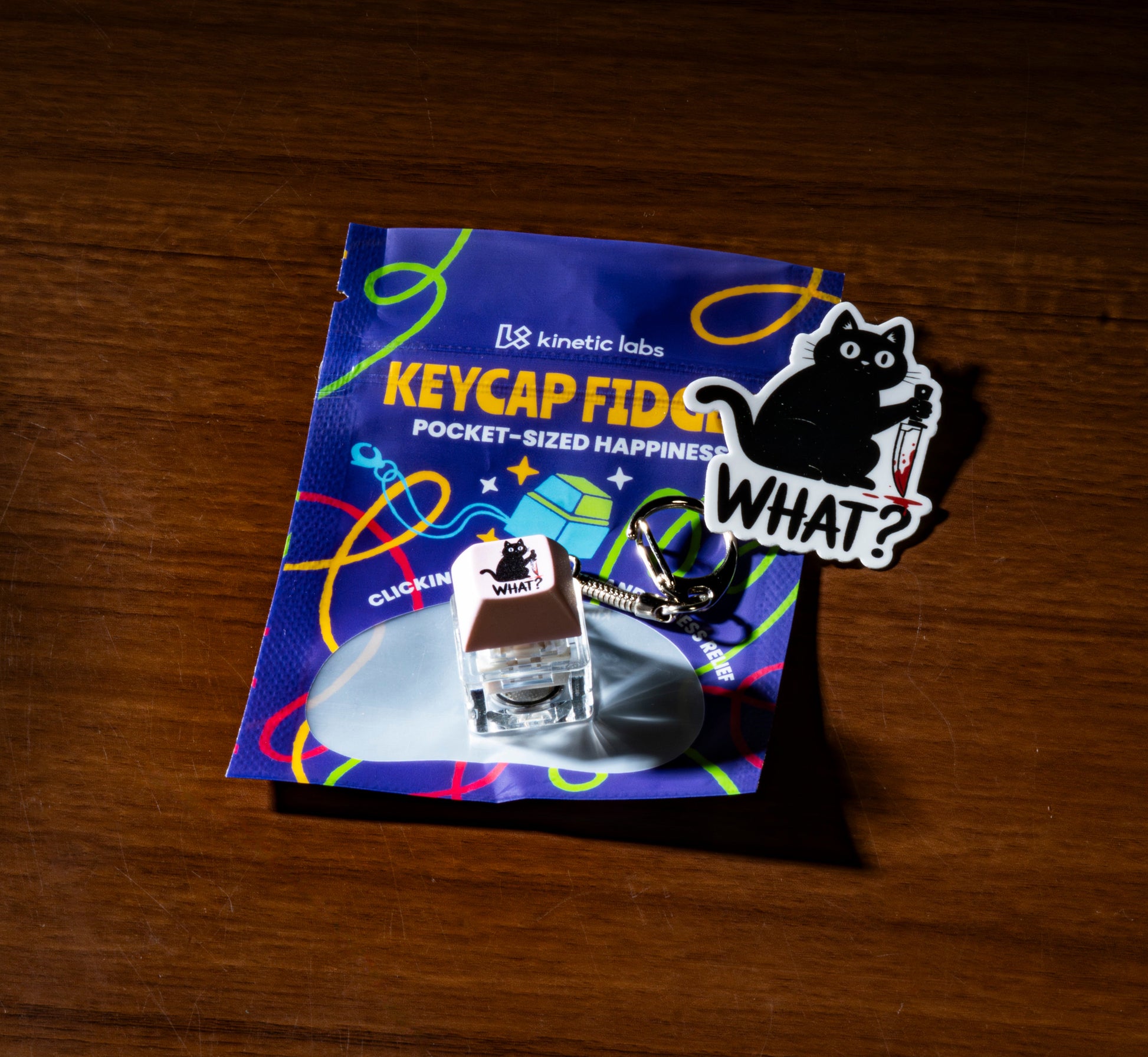 Funny keycap fidget keychain with blue “KEYCAP FID…” themed packaging and keycap