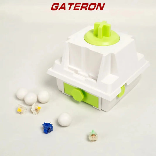 Mechanical switch with white housing and lime green stem, plus loose switch parts