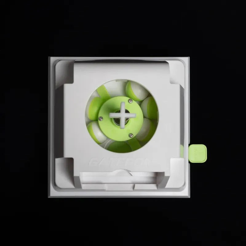 Mechanical switch showing lime green cross stem inside a clear windowed case