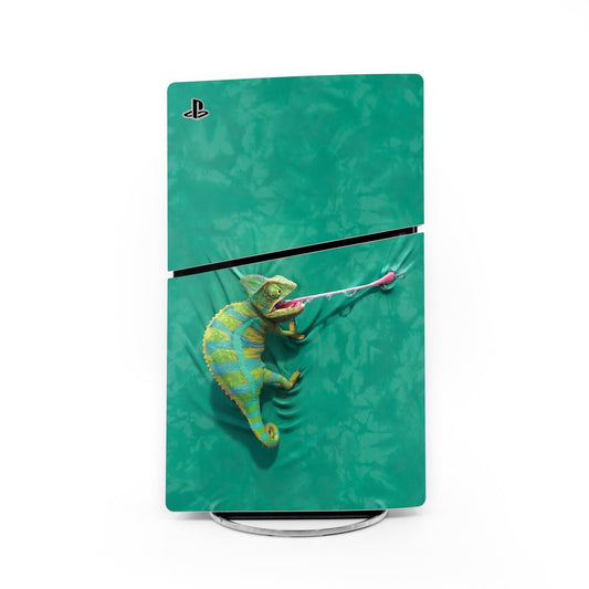 PS5 Slim skin with PlayStation logo, teal green iguana artwork and black center stripe