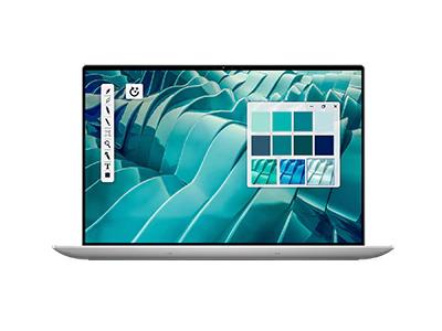 Dell laptop with teal abstract desktop screen and silver keyboard base