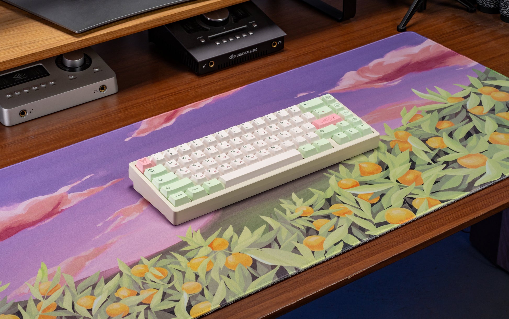 Keyboard keycaps in pastel colors: white keys with mint modifiers and small pink accents.