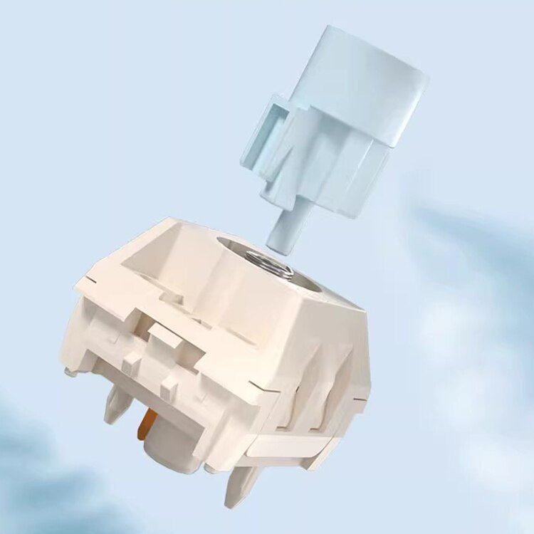 Mechanical keyboard switch underside with white housing, pin stems and metal contact